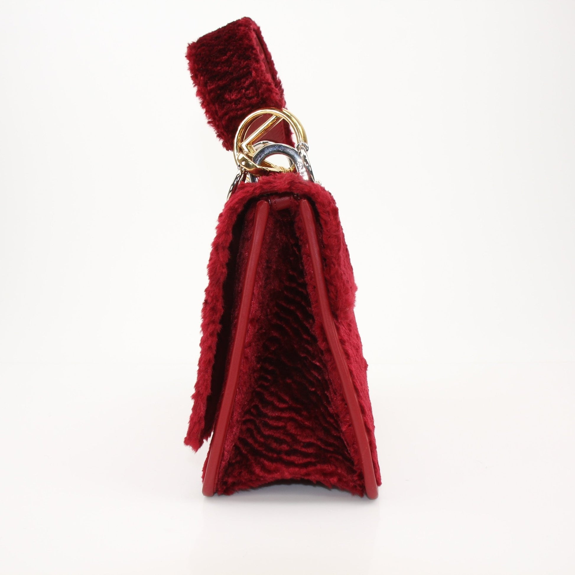 Fendi Kan I F velvet shoulder handbag with gold hardware, featuring a structured design and elegant craftsmanship.