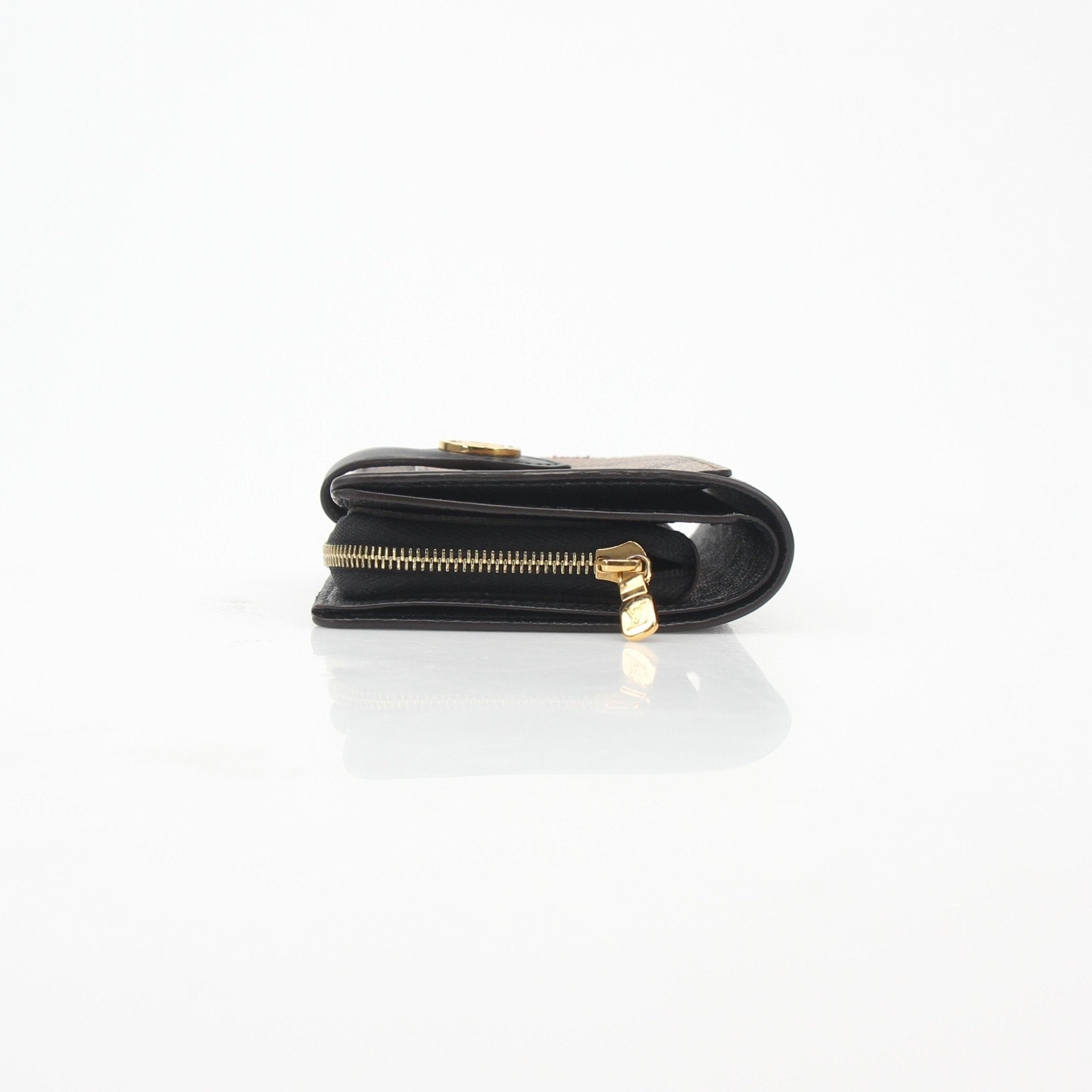 Louis Vuitton Monogram Reverse Juliette Wallet with gold hardware and multiple card slots, crafted from signature monogram canvas.