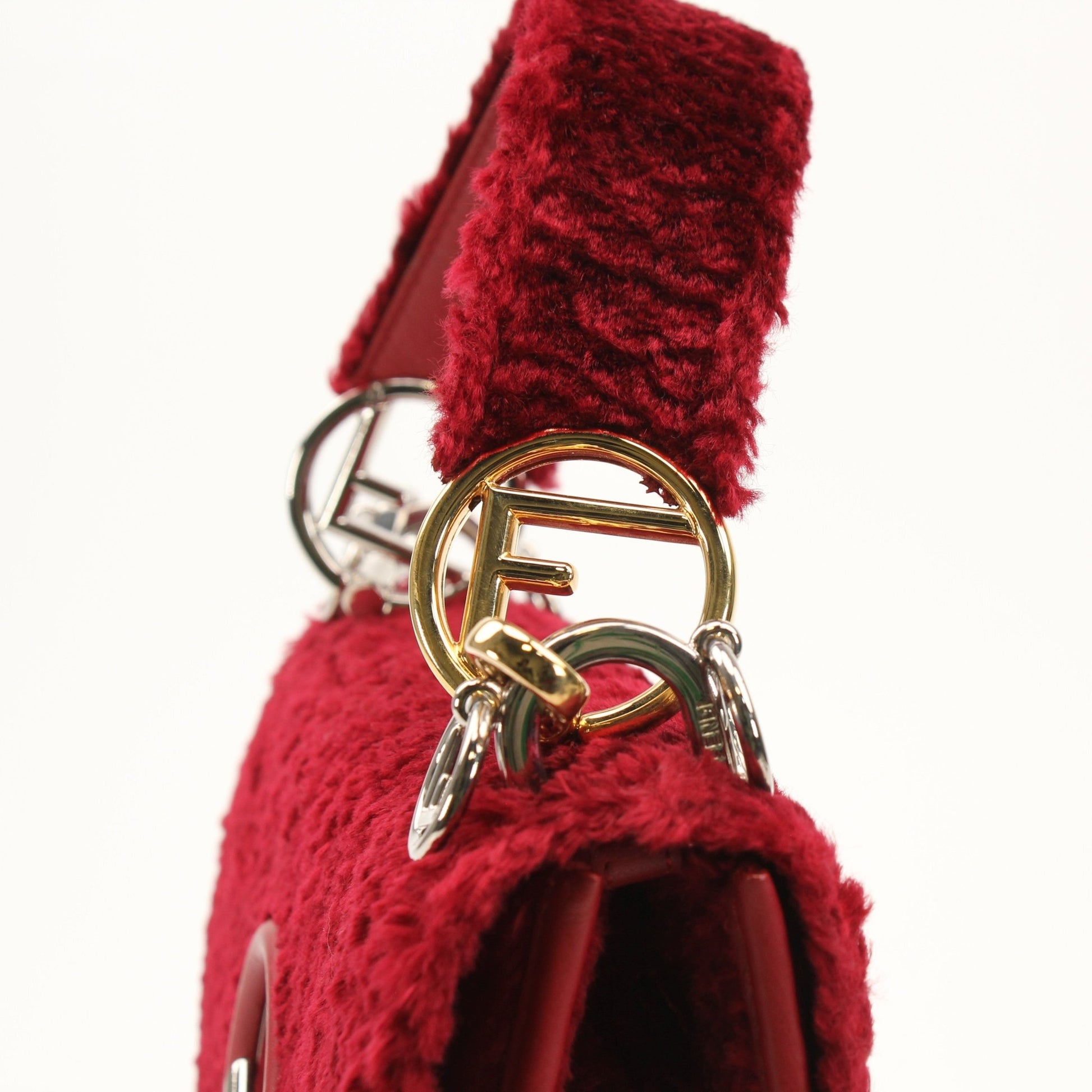 Fendi Kan I F velvet shoulder handbag with gold hardware, featuring a sleek design and plush fabric, by Gold & Beyond.