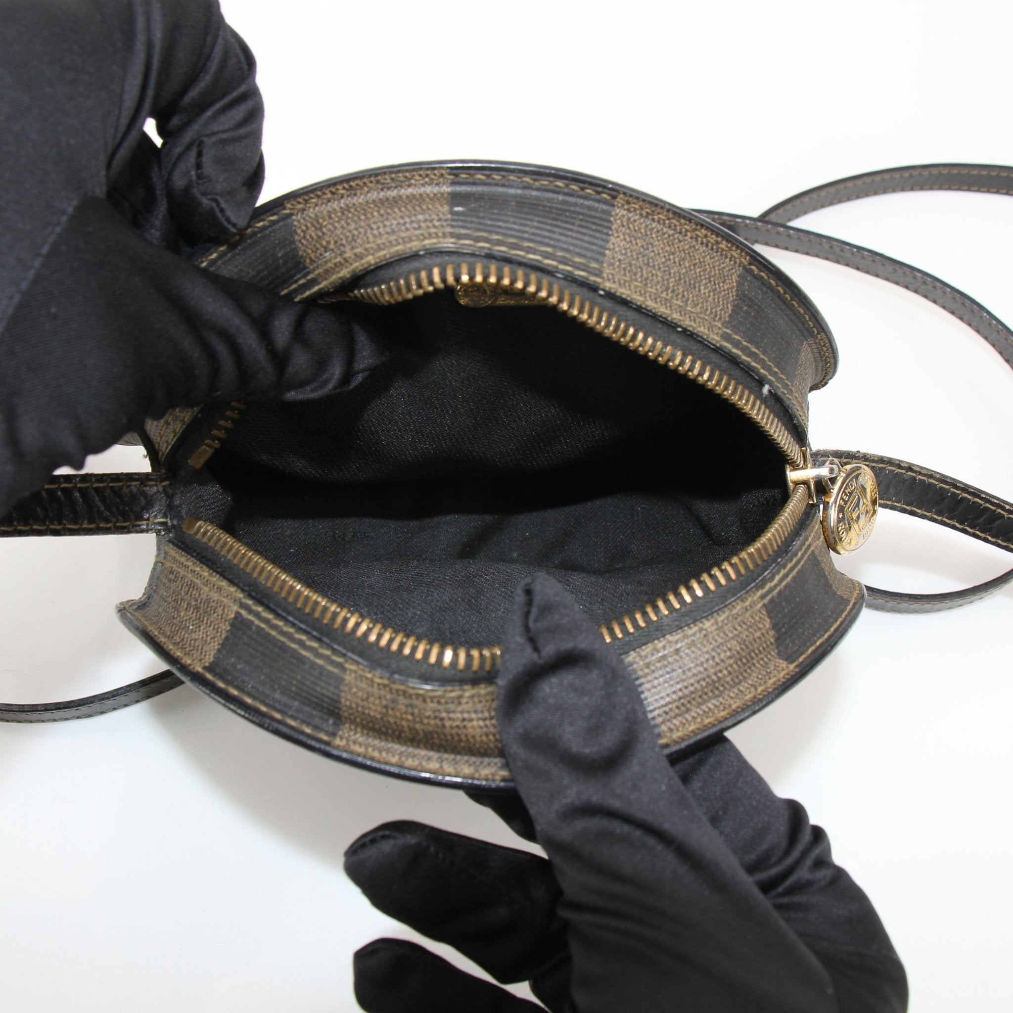 Fendi vintage shoulder baguette handbag with gold hardware, featuring a classic design and textured leather finish.