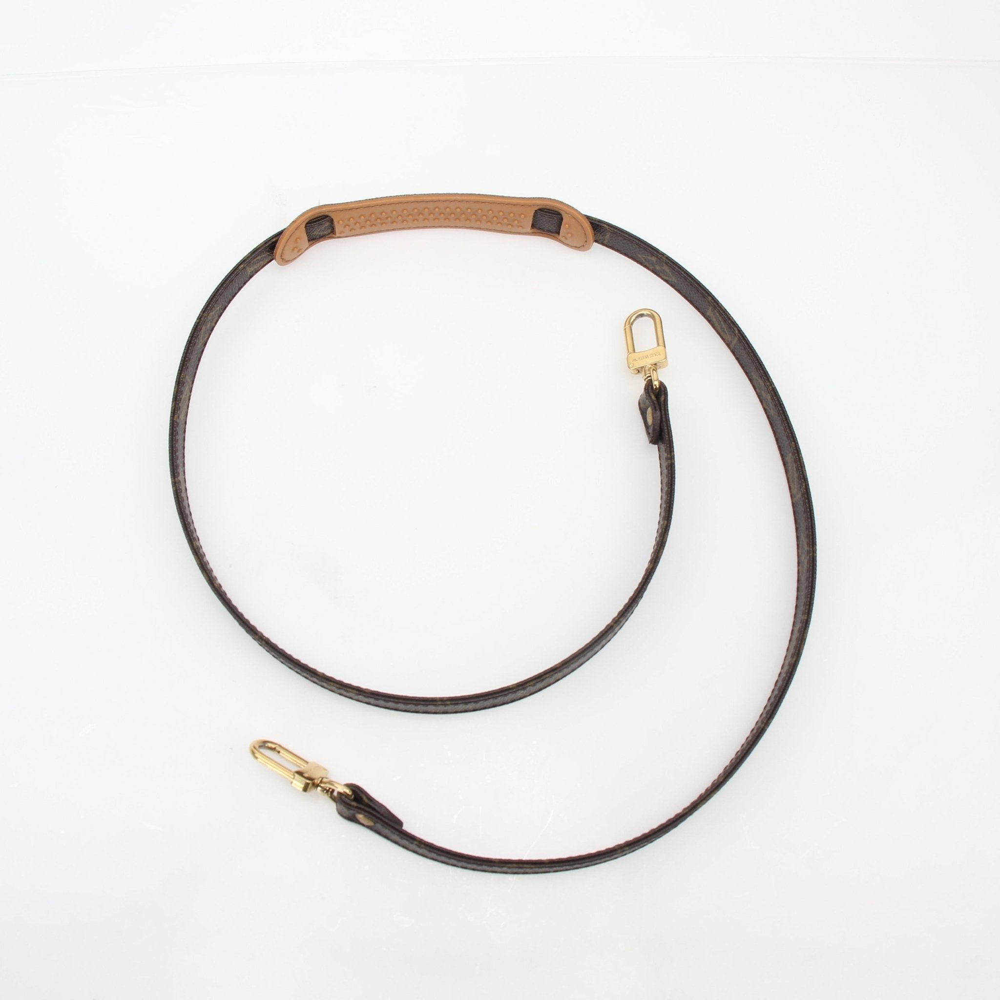 Louis Vuitton Monogram adjustable shoulder strap for accessories, featuring gold hardware and signature monogram pattern.