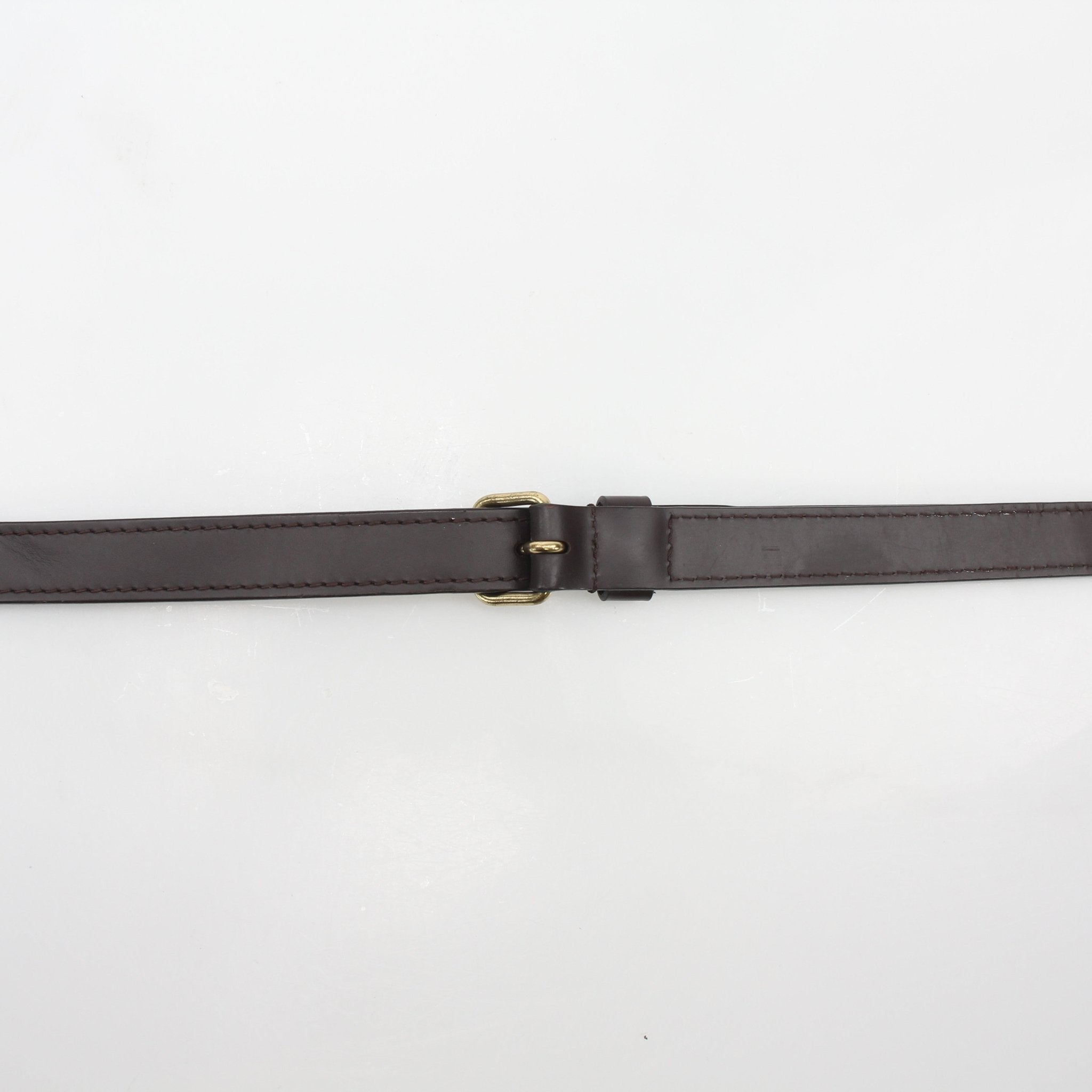 Louis Vuitton brown leather adjustable shoulder strap for accessories, featuring gold-tone hardware and detailed stitching.