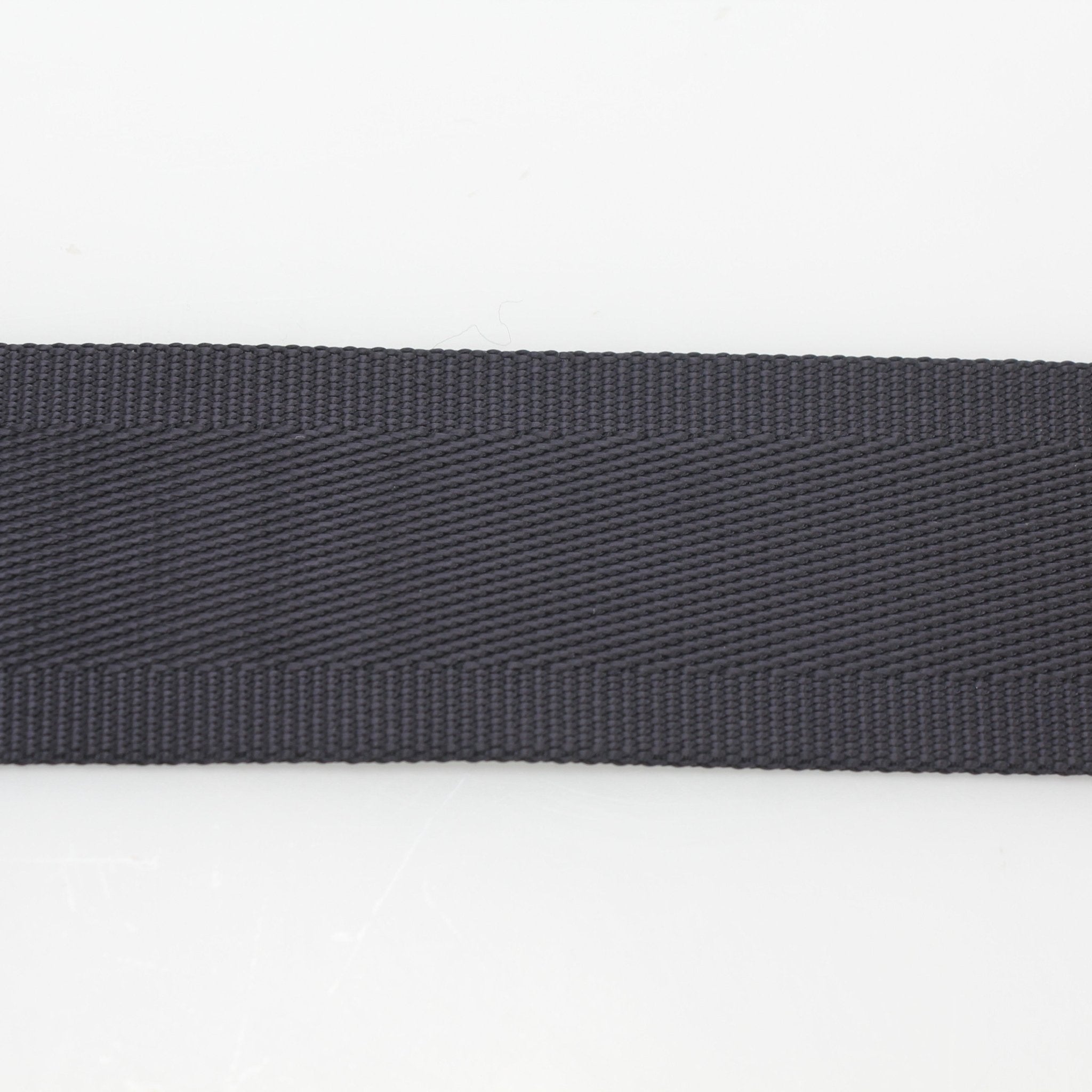 Gucci black GG nylon belt with gold buckle, stylish accessories for men and women, featuring the iconic Gucci logo design.