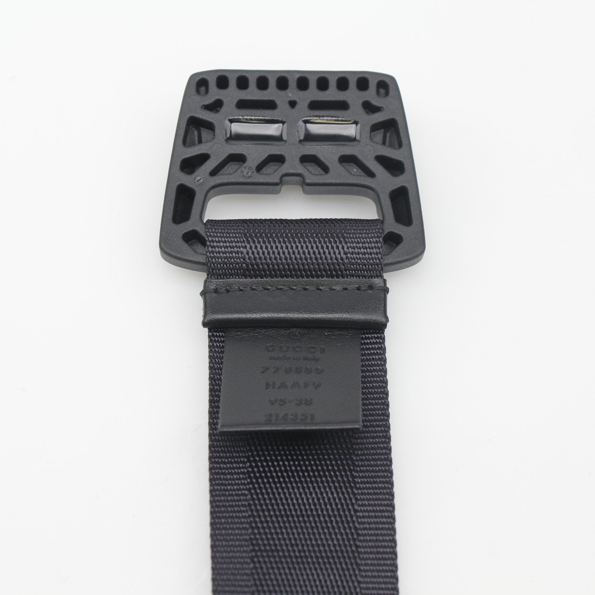 Gucci black GG nylon belt with gold buckle, stylish accessories for men and women, featuring iconic logo design.