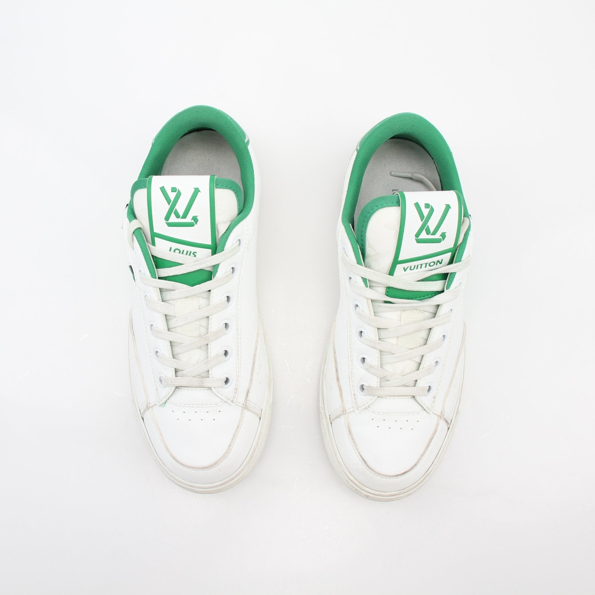 Louis Vuitton white and green Charlie low-top sneakers by Gold & Beyond, showing side view with laces and stylish design