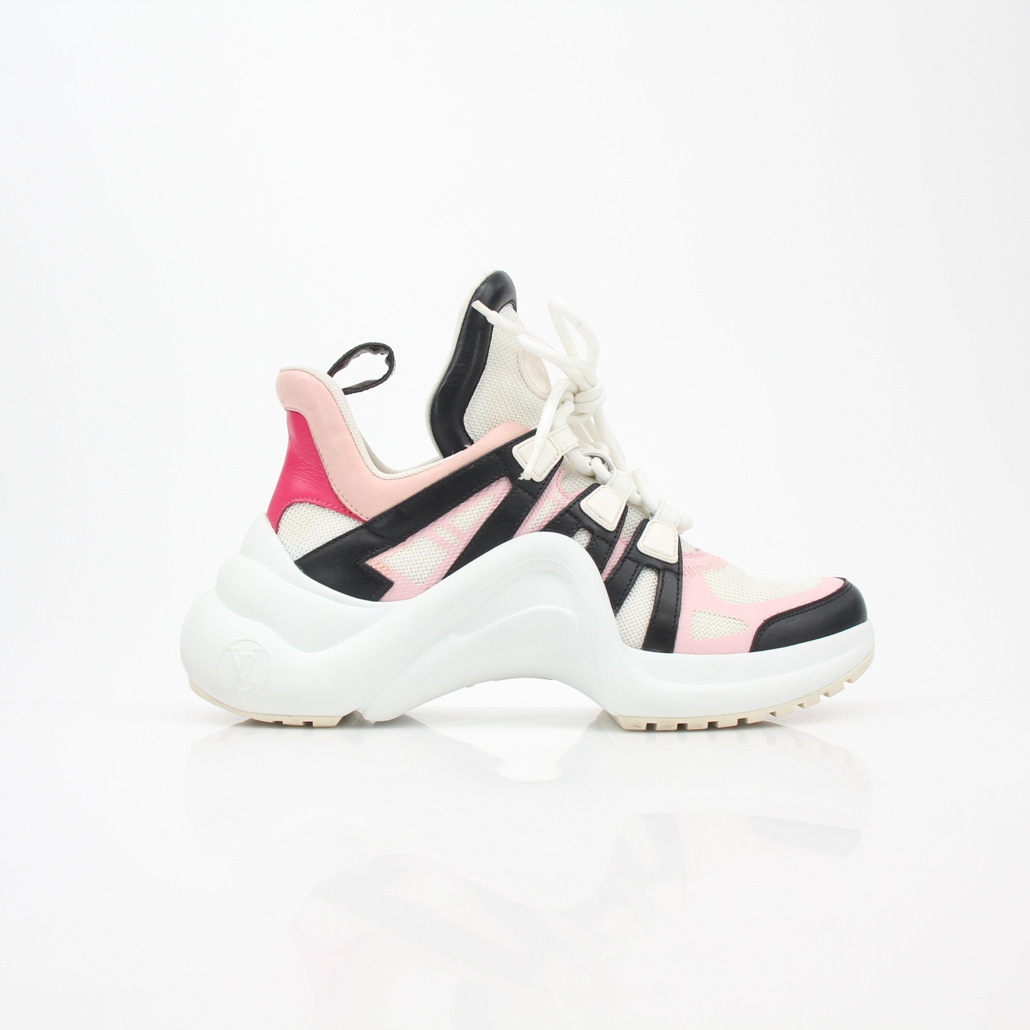 Gold & Beyond pink Louis Vuitton Archlight low-top sneakers with chunky soles and sleek design, displayed on a white background.