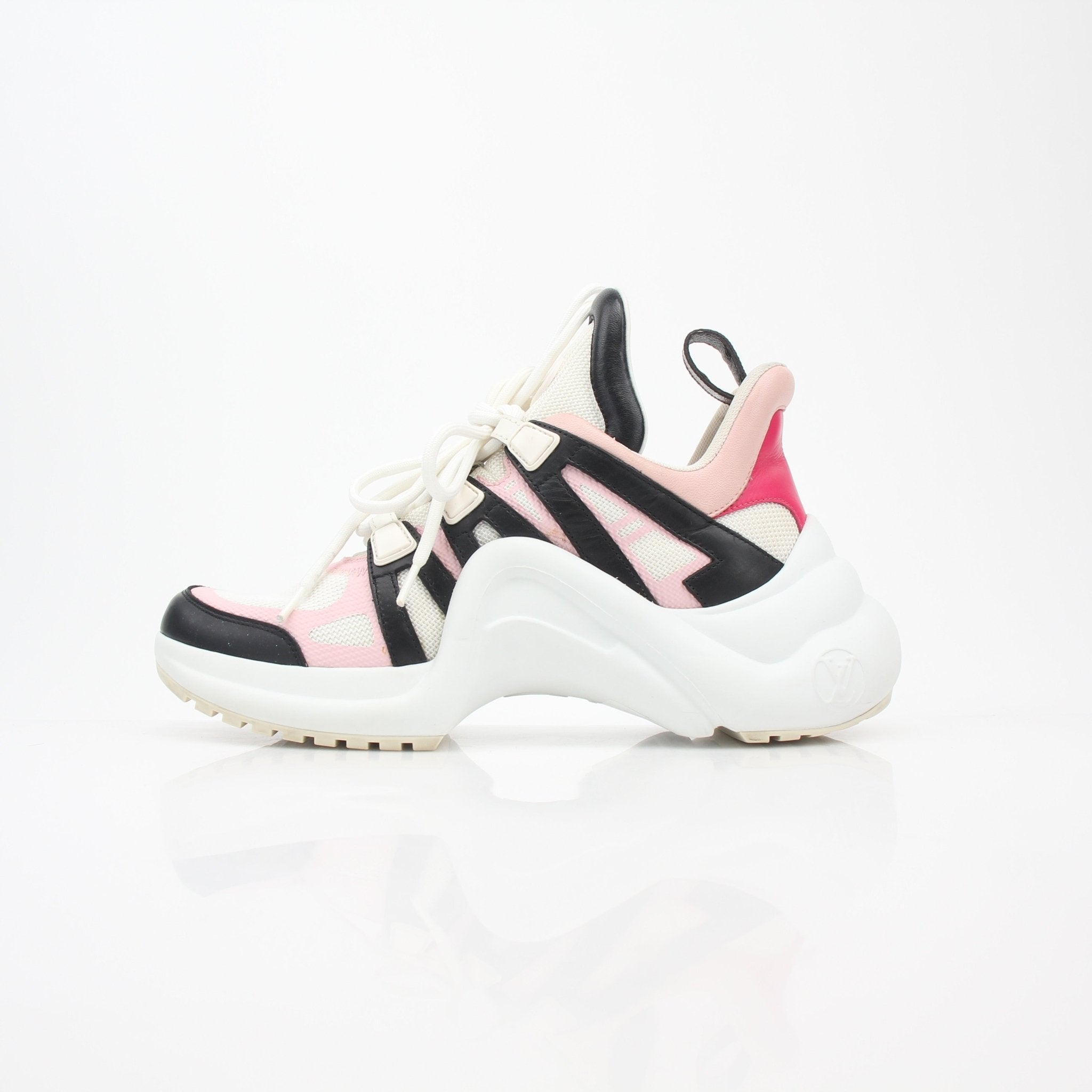 Gold & Beyond pink Louis Vuitton Archlight low-top sneakers featuring a chunky sole and sleek design, shown on a clean background.
