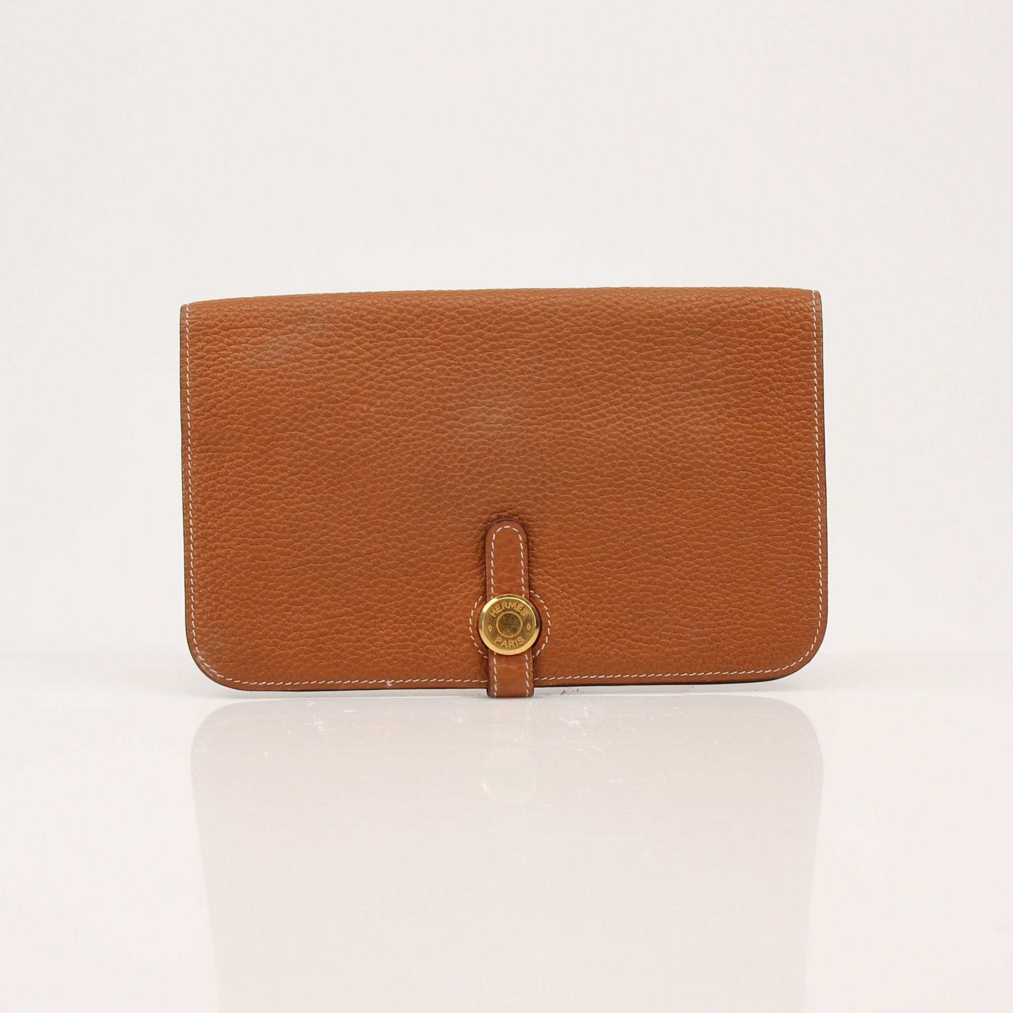 Hermès Brown Dogon Wallet by Gold & Beyond, showcasing a sleek leather wallet with gold hardware and compact design.