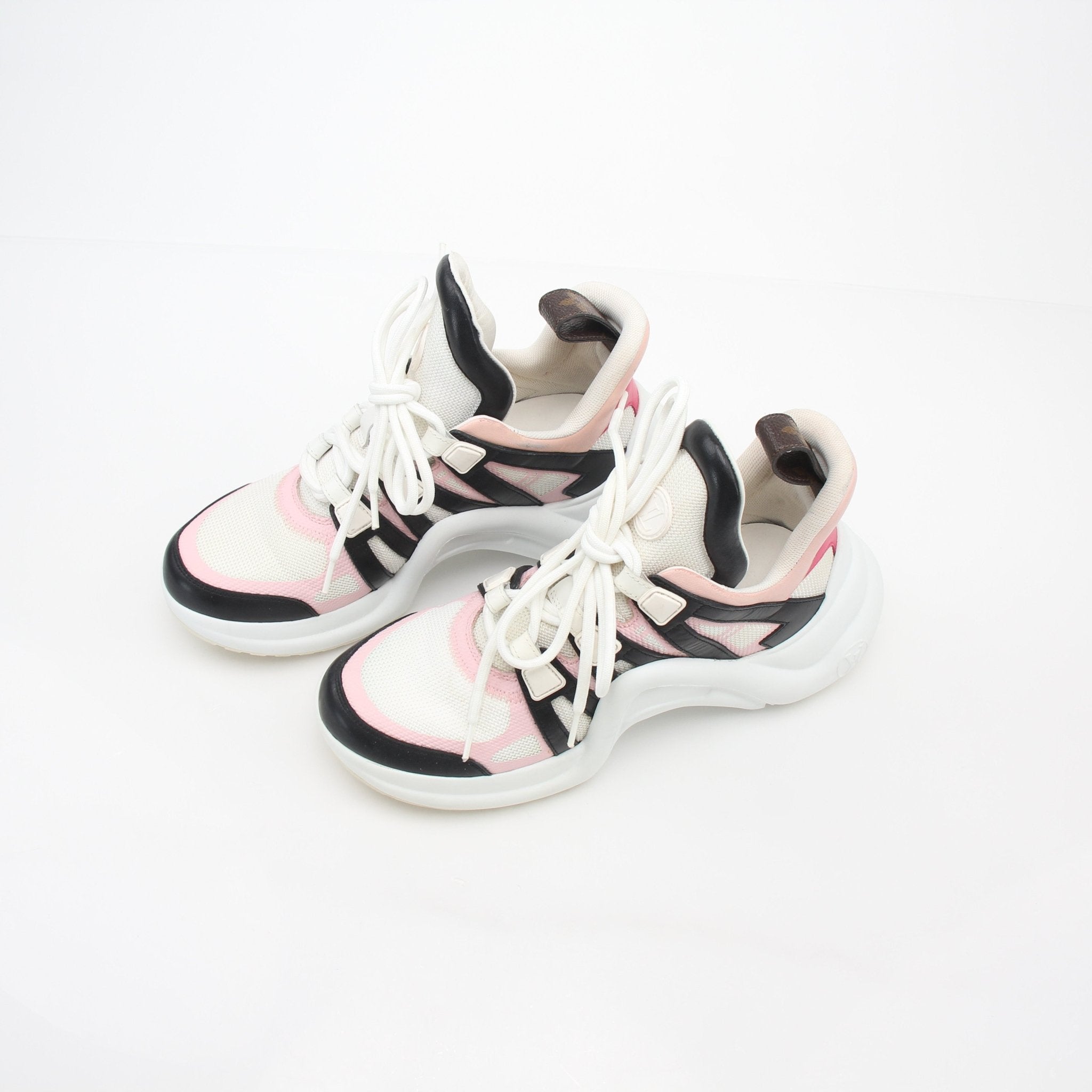 Pink Louis Vuitton Archlight low-top sneakers featuring a chunky sole and stylish design, displayed on a white background.