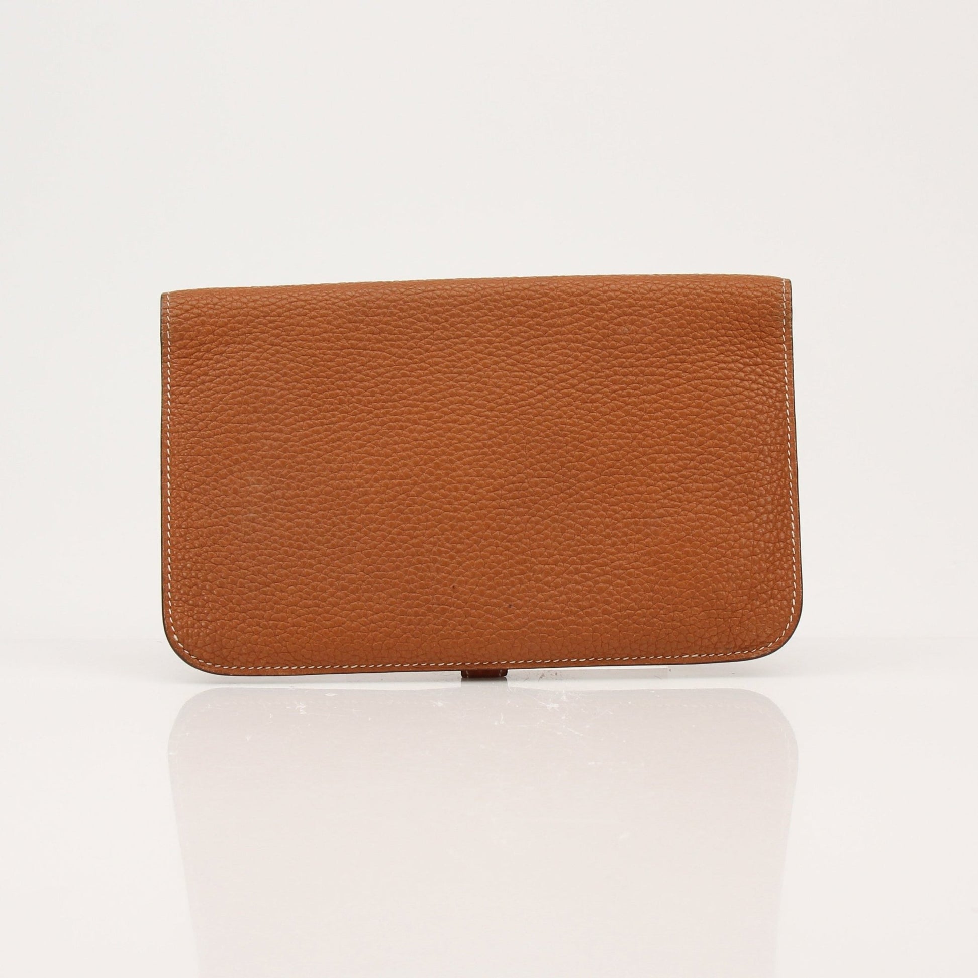 Hermès Brown Dogon wallet by Gold & Beyond, showcasing genuine leather with detailed stitching and compact design.