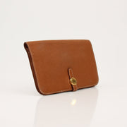 Hermès Brown Dogon Wallet by Gold & Beyond, showcasing a sleek leather wallet with detailed stitching and compact design.
