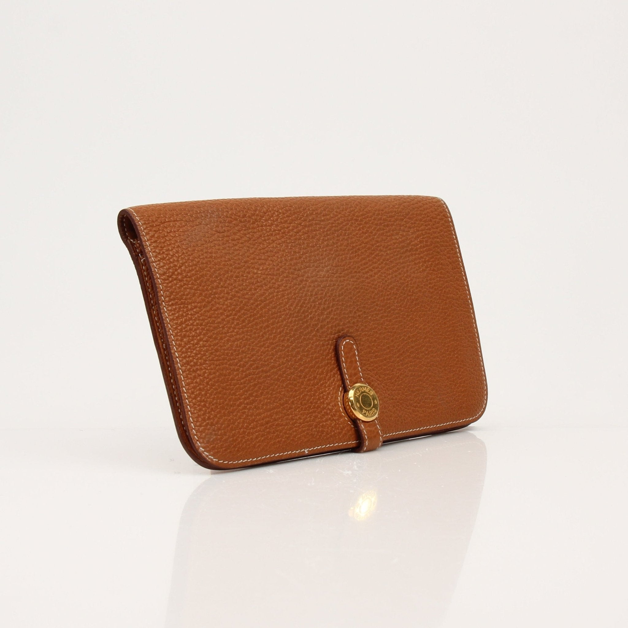 Hermès Brown Dogon Wallet by Gold & Beyond, showcasing a sleek leather wallet with detailed stitching and compact design.
