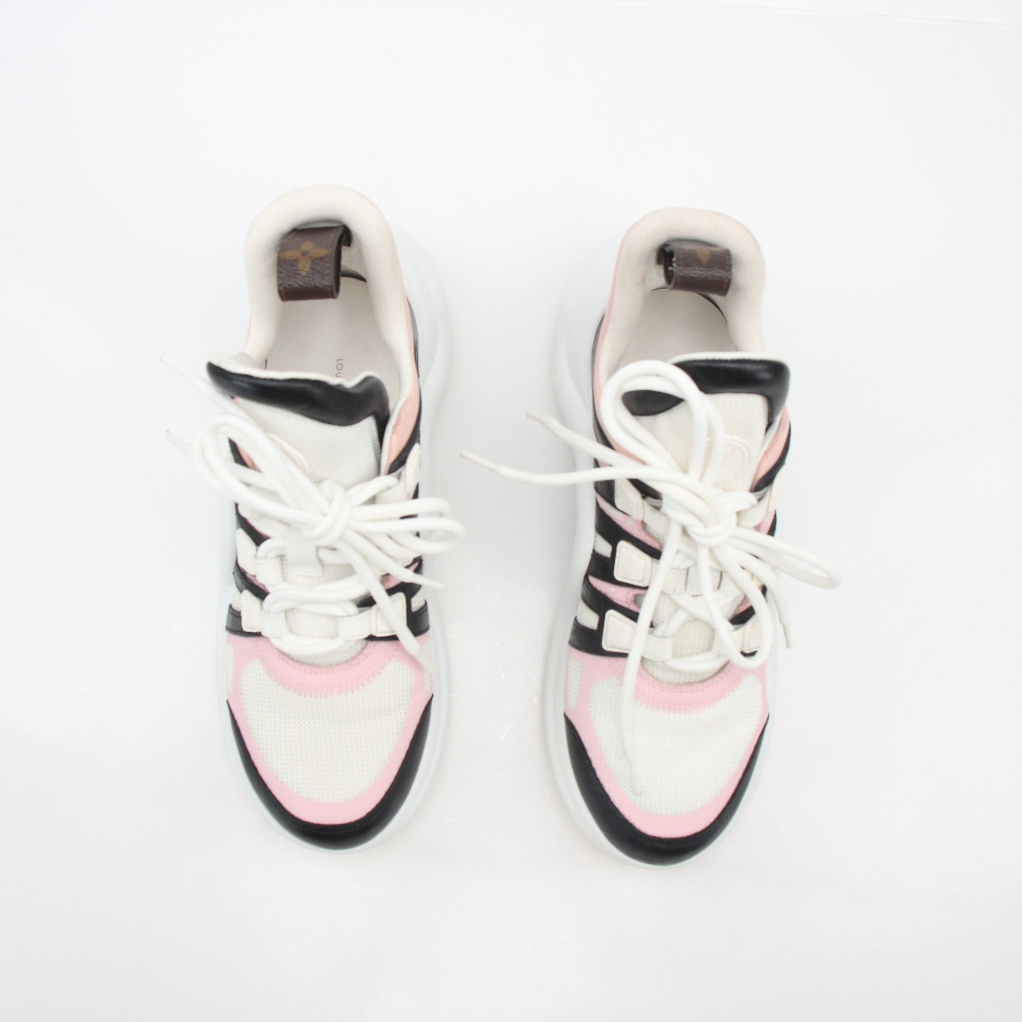 Pink Louis Vuitton Archlight low-top sneakers with chunky soles and sporty design, by Gold & Beyond.