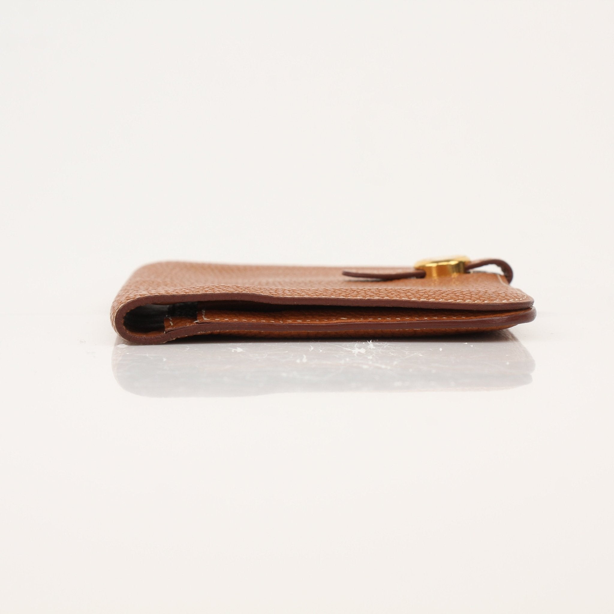 Hermès Brown Dogon Wallet by Gold & Beyond showing textured leather with multiple card slots and a sleek compact design.