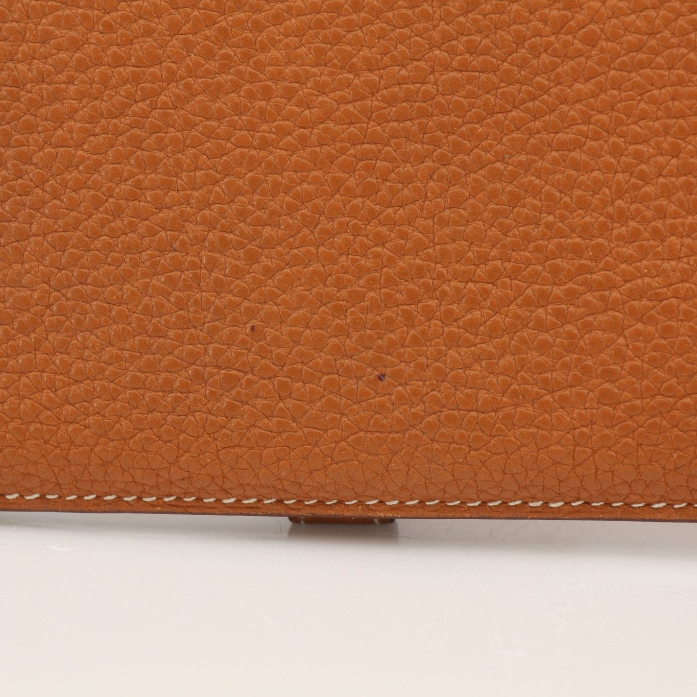 Hermès brown Dogon wallet by Gold & Beyond, featuring leather design and compact size, displayed on a neutral background.