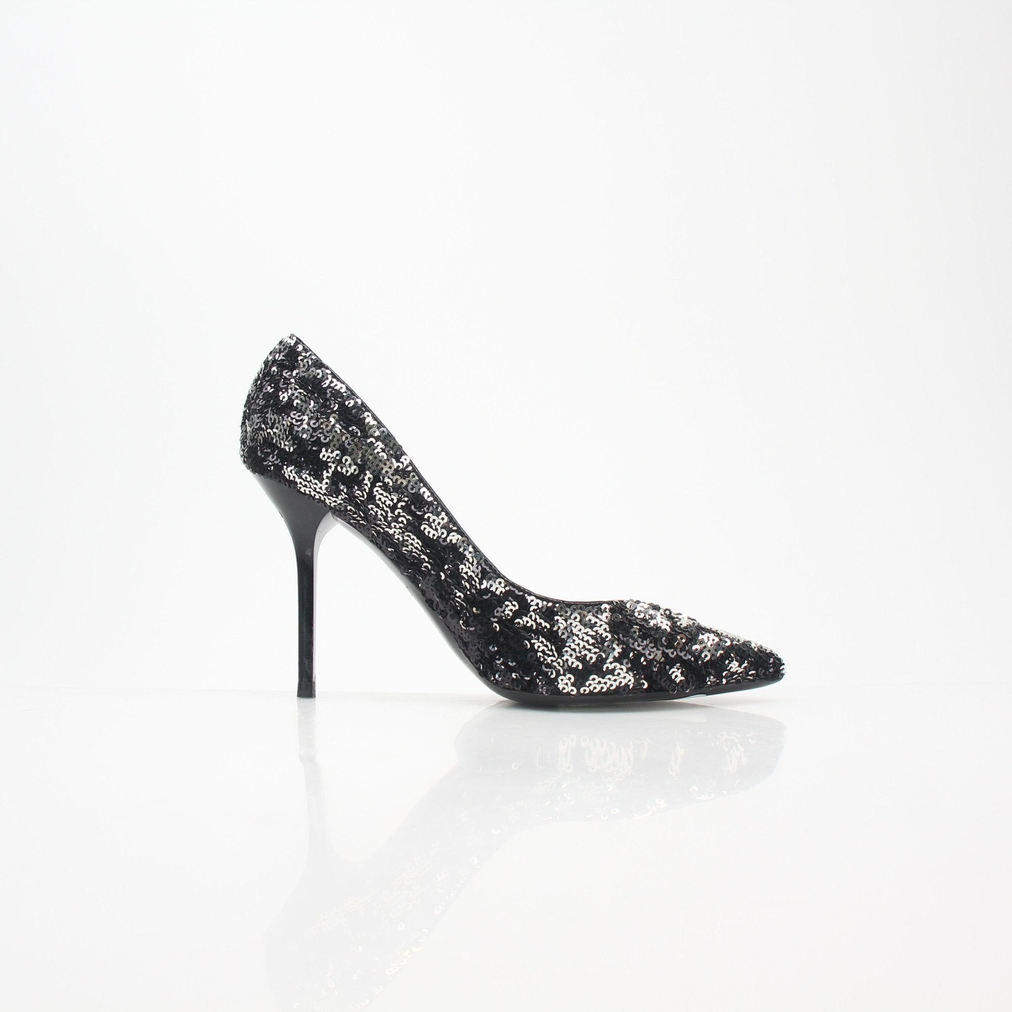 Louis Vuitton Black and Silver Liza Sequin Pumps heels with shiny sequins and sleek design, photographed on a plain background.