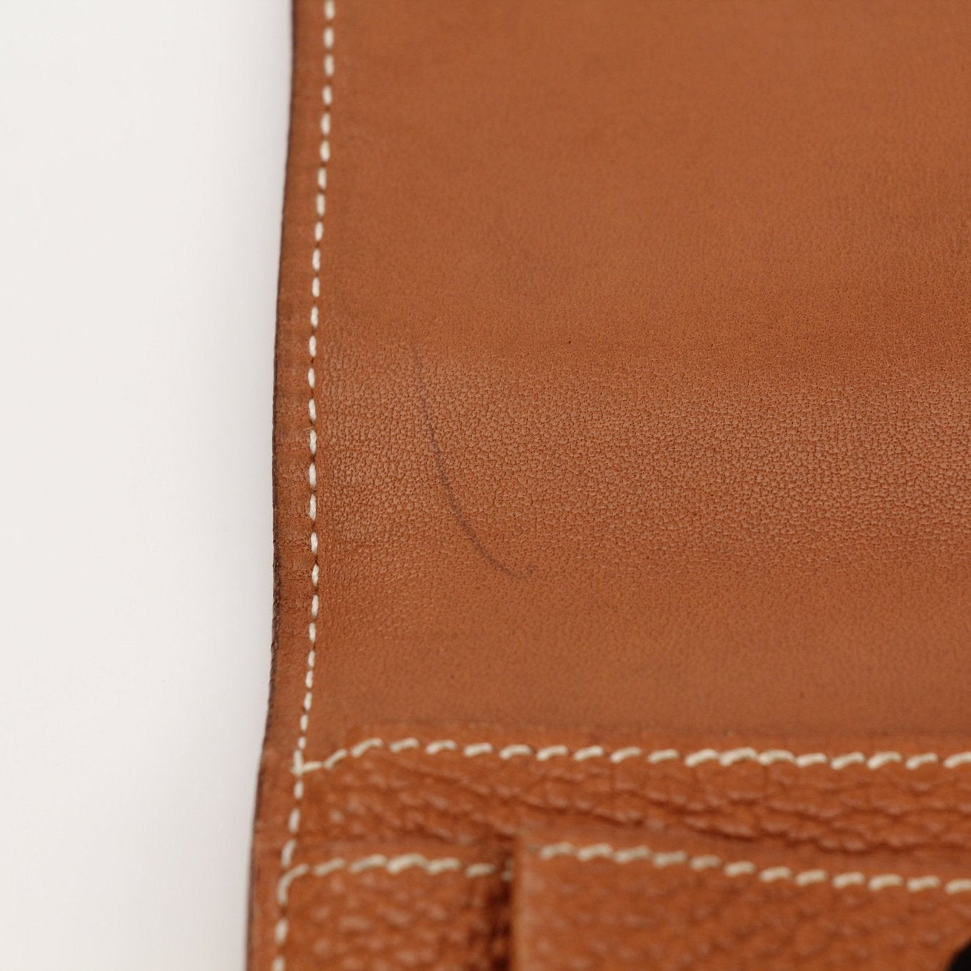 Hermès Brown Dogon Wallet by Gold & Beyond, showcasing the textured leather exterior and compact design for everyday use.