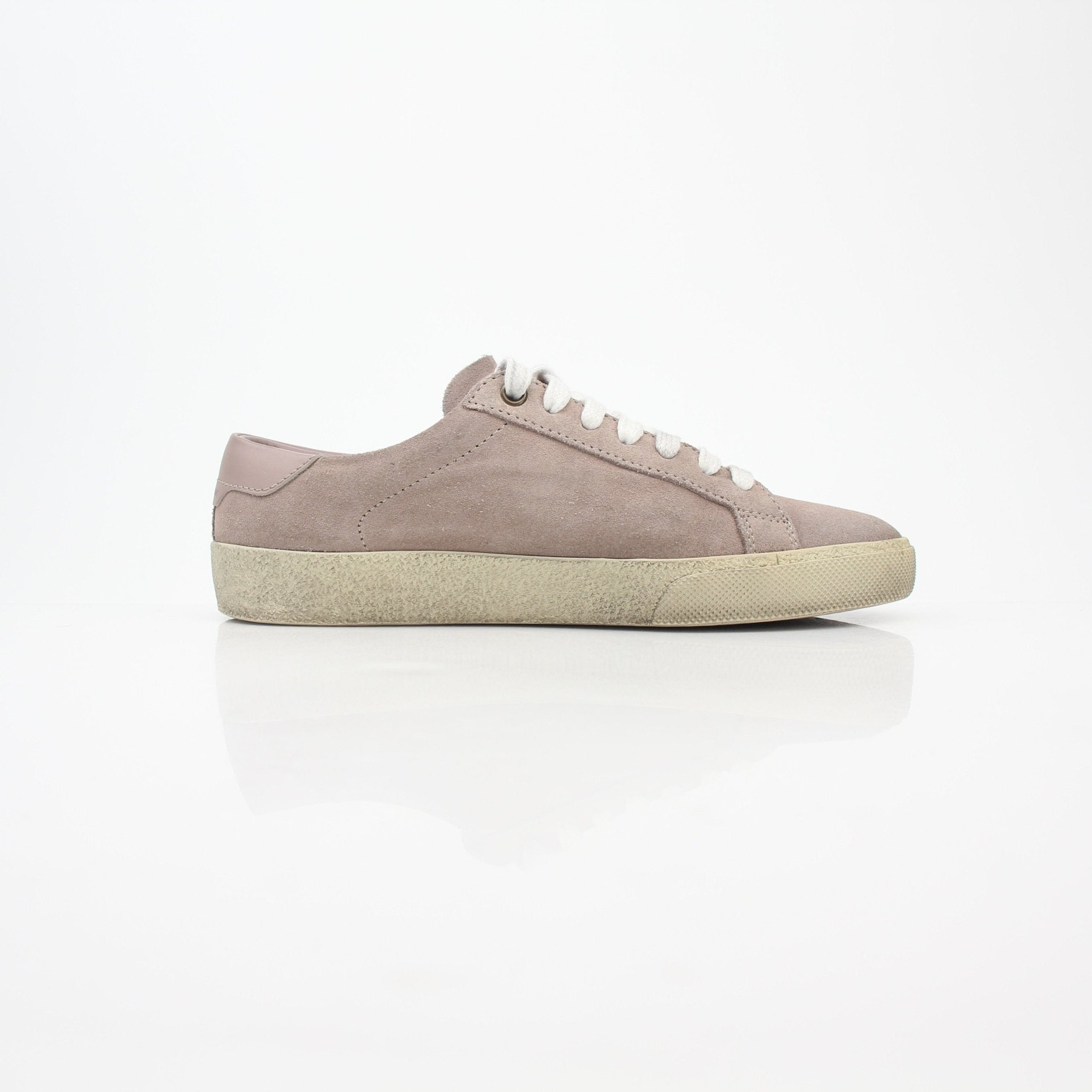 Pink suede Saint Laurent Court Classic low-top sneakers with white rubber soles and sleek design.