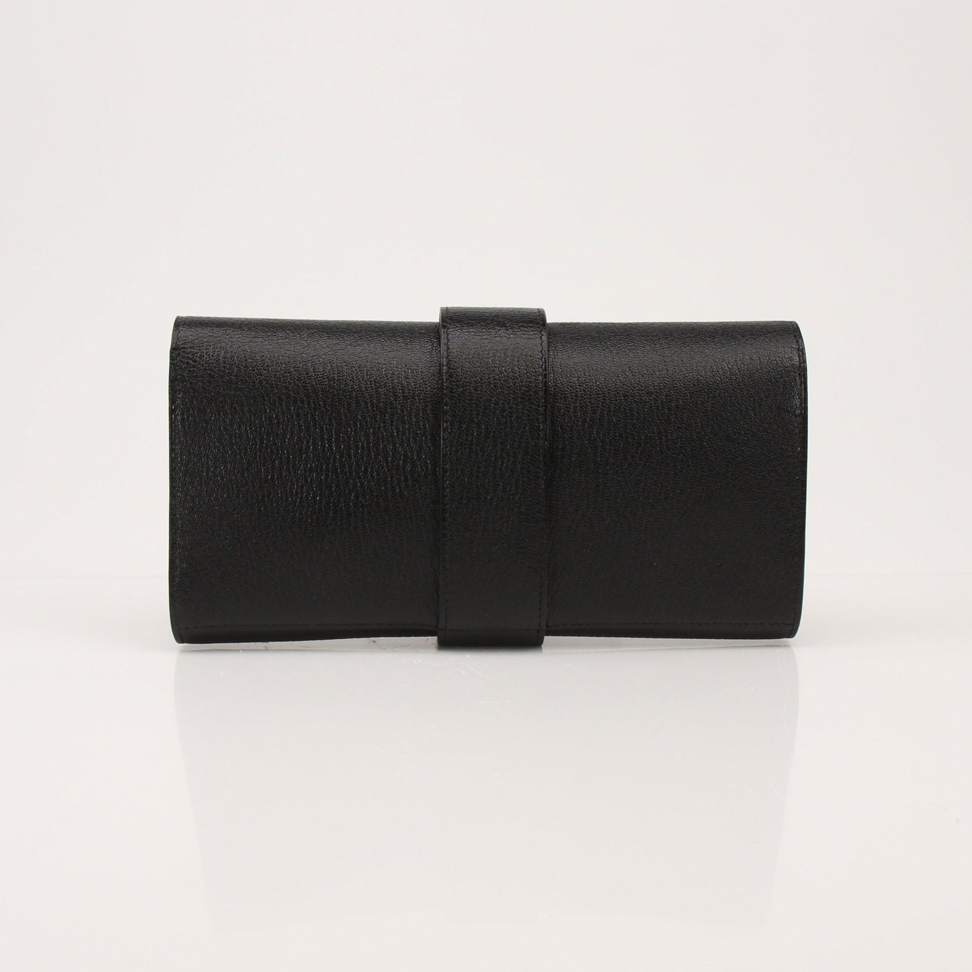Hermès Collier de Chien black clutch handbag with gold hardware and textured leather, featuring signature design details.