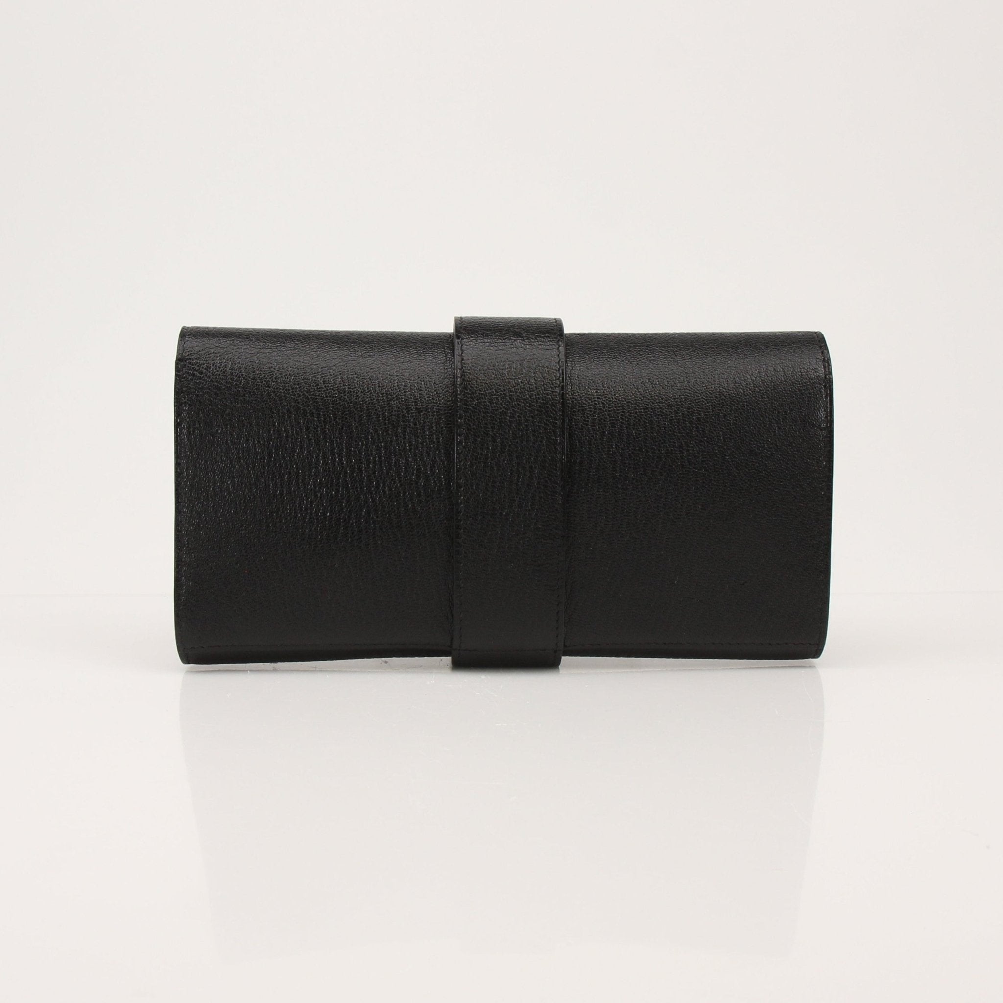 Hermès Collier de Chien black clutch handbag with gold hardware and textured leather, featuring signature design details.