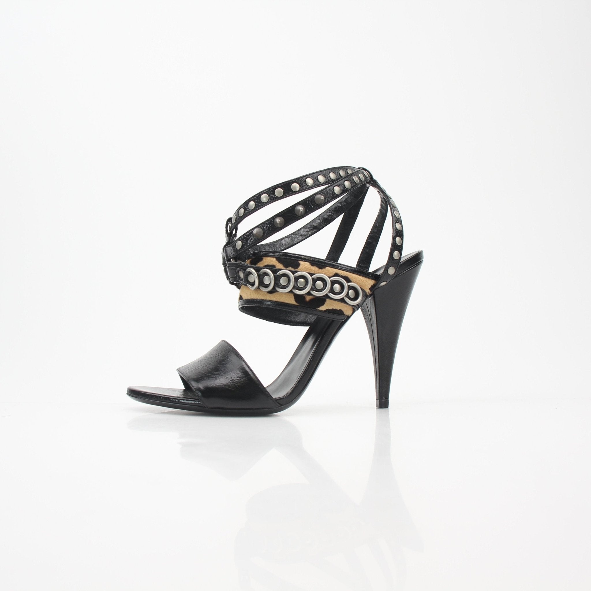 Black studded leopard-print high-heel sandals by Saint Laurent, featuring strappy design and stylish metallic accents.