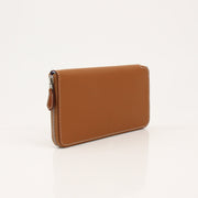 Hermès Brown Veau Epsom Silk In Wallet with gold-tone hardware, compact design, and textured leather finish.