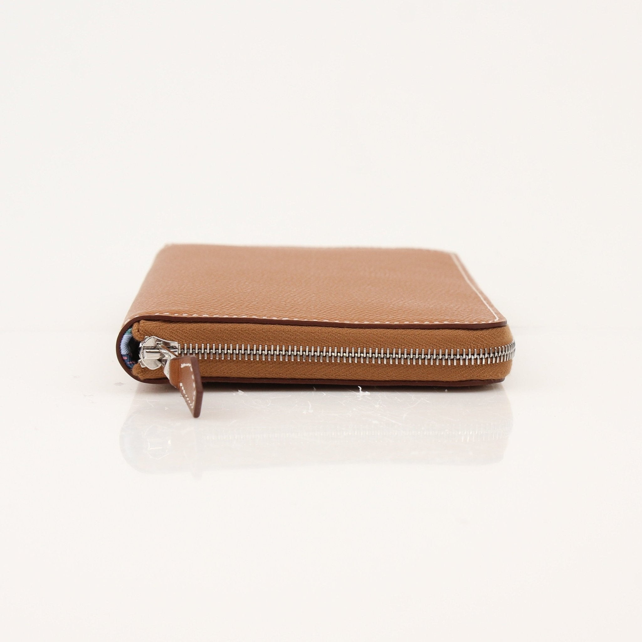 Brown Hermès Veau Epsom Silk In Wallet with gold-tone hardware, featuring multiple card slots and a sleek design.