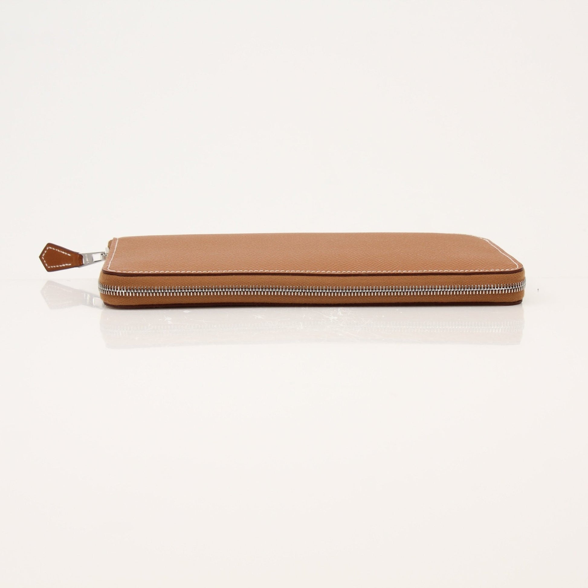 Hermès brown Veau Epsom Silk In wallet featuring smooth leather finish and compact design, showcasing luxury craftsmanship.