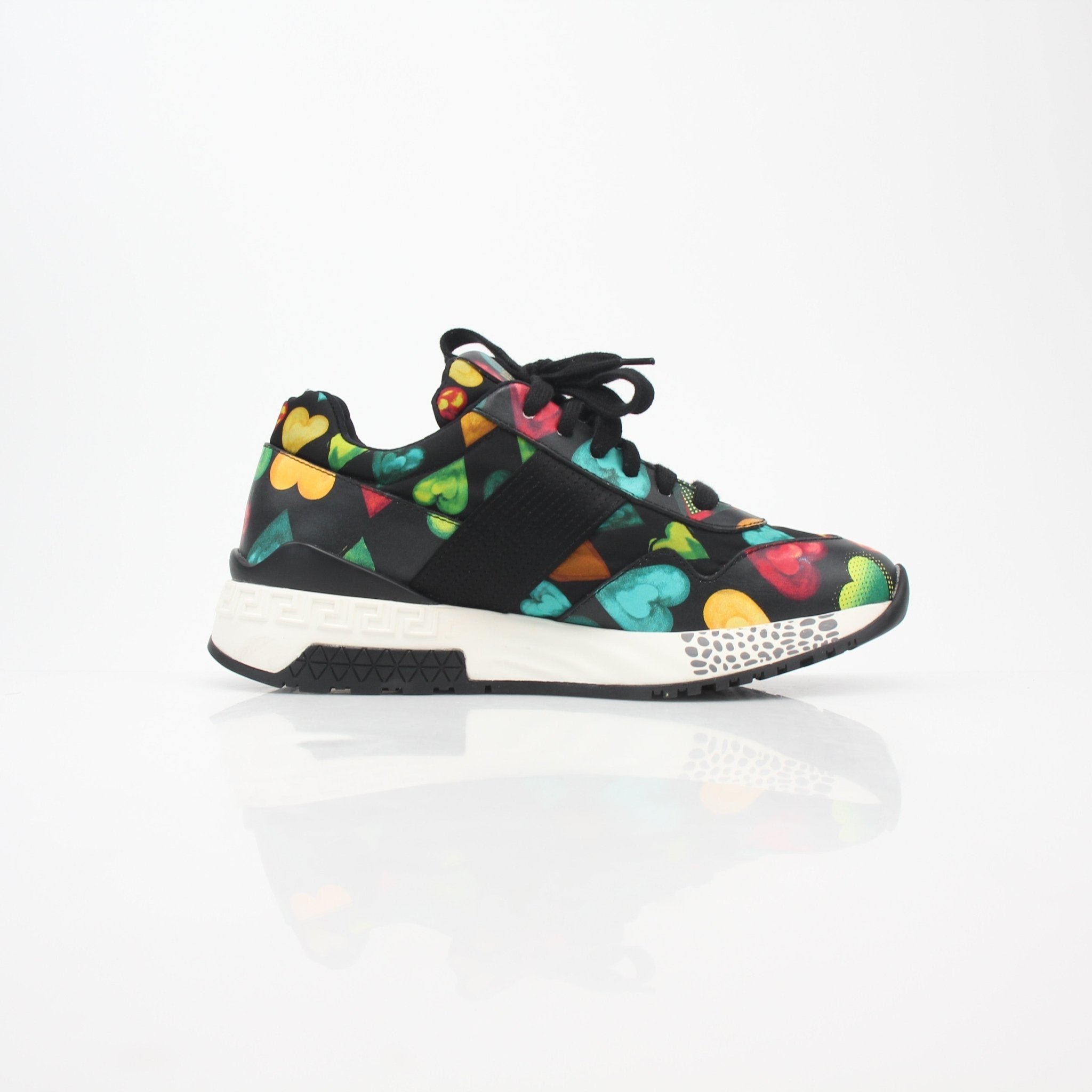 Gold & Beyond Versace multicolor heart-print Achilles low-top sneakers with vibrant design and classic shoe silhouette.