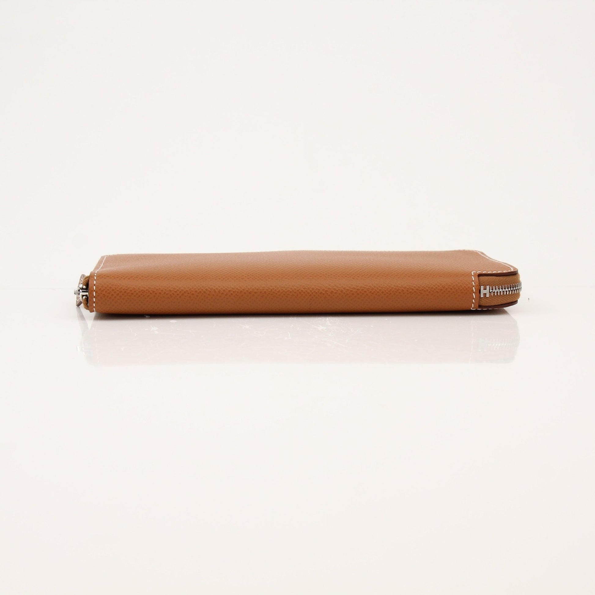 Hermès Brown Veau Epsom Silk Wallet with gold accents, featuring a sleek compact design and multiple card slots.