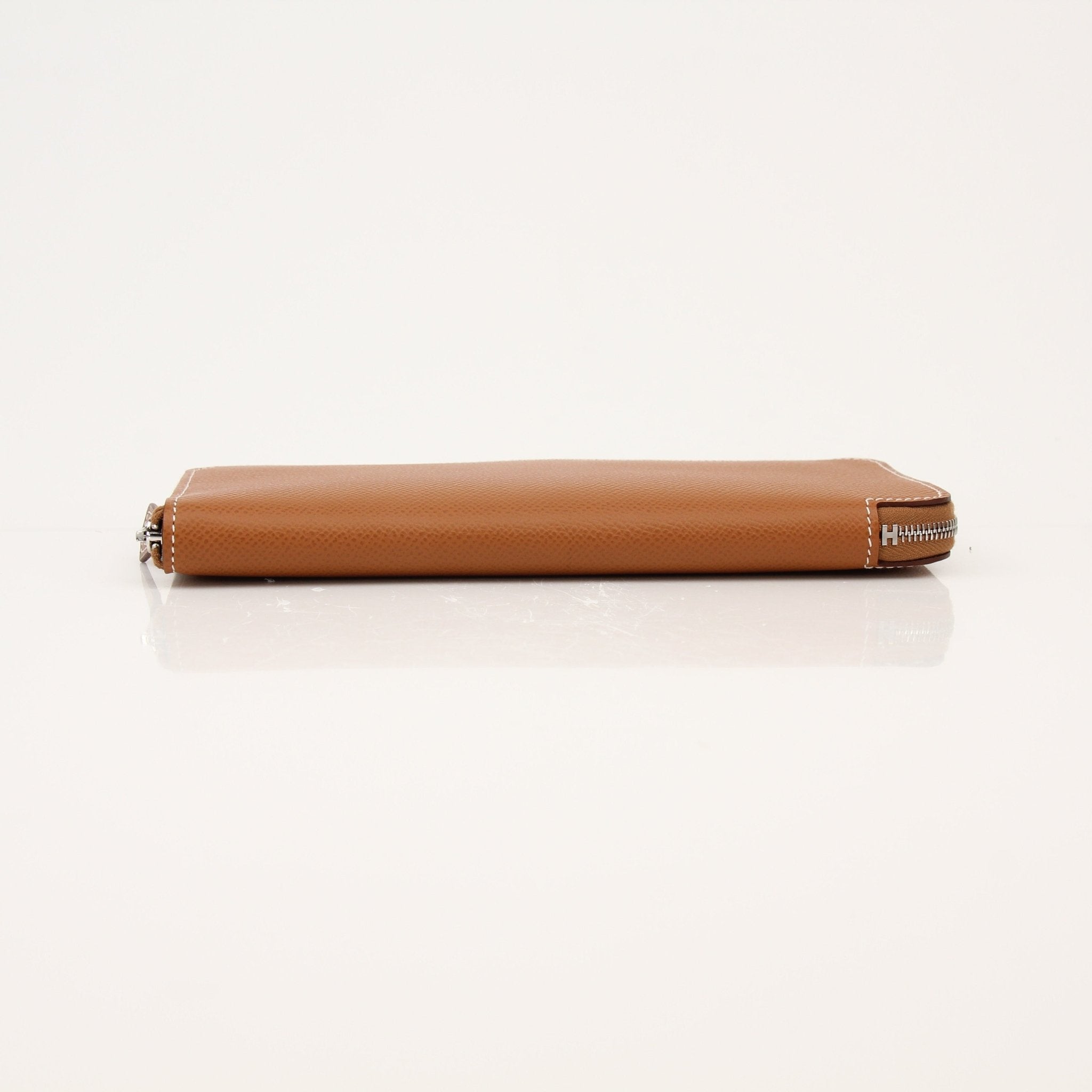Hermès Brown Veau Epsom Silk Wallet with gold accents, featuring a sleek compact design and multiple card slots.