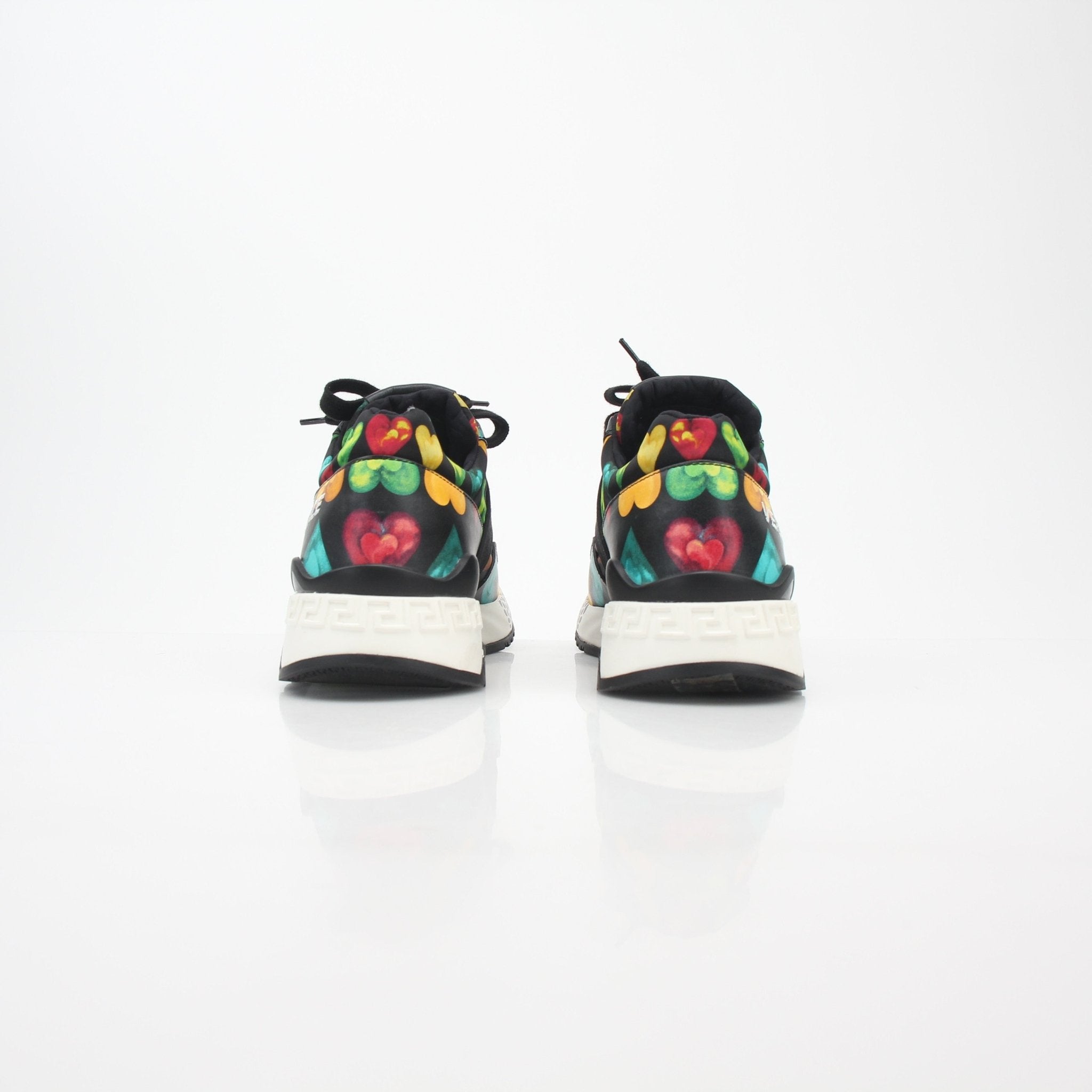 Gold & Beyond Versace multicolor heart-print Achilles low-top sneakers with vibrant design and casual shoe style.