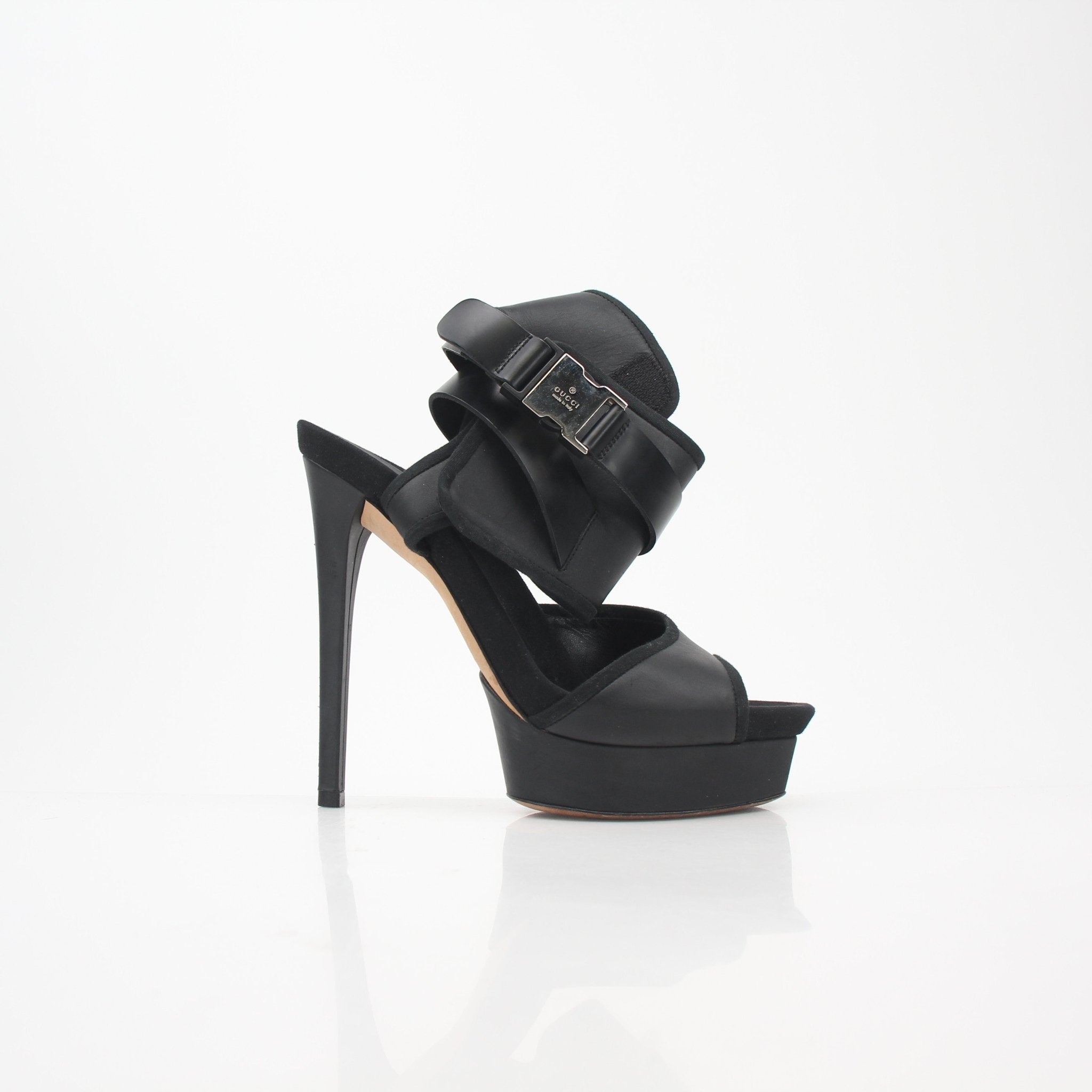Gucci Black Babylon Platform Sandals heels with chunky heels and ankle straps, styled on a neutral background.