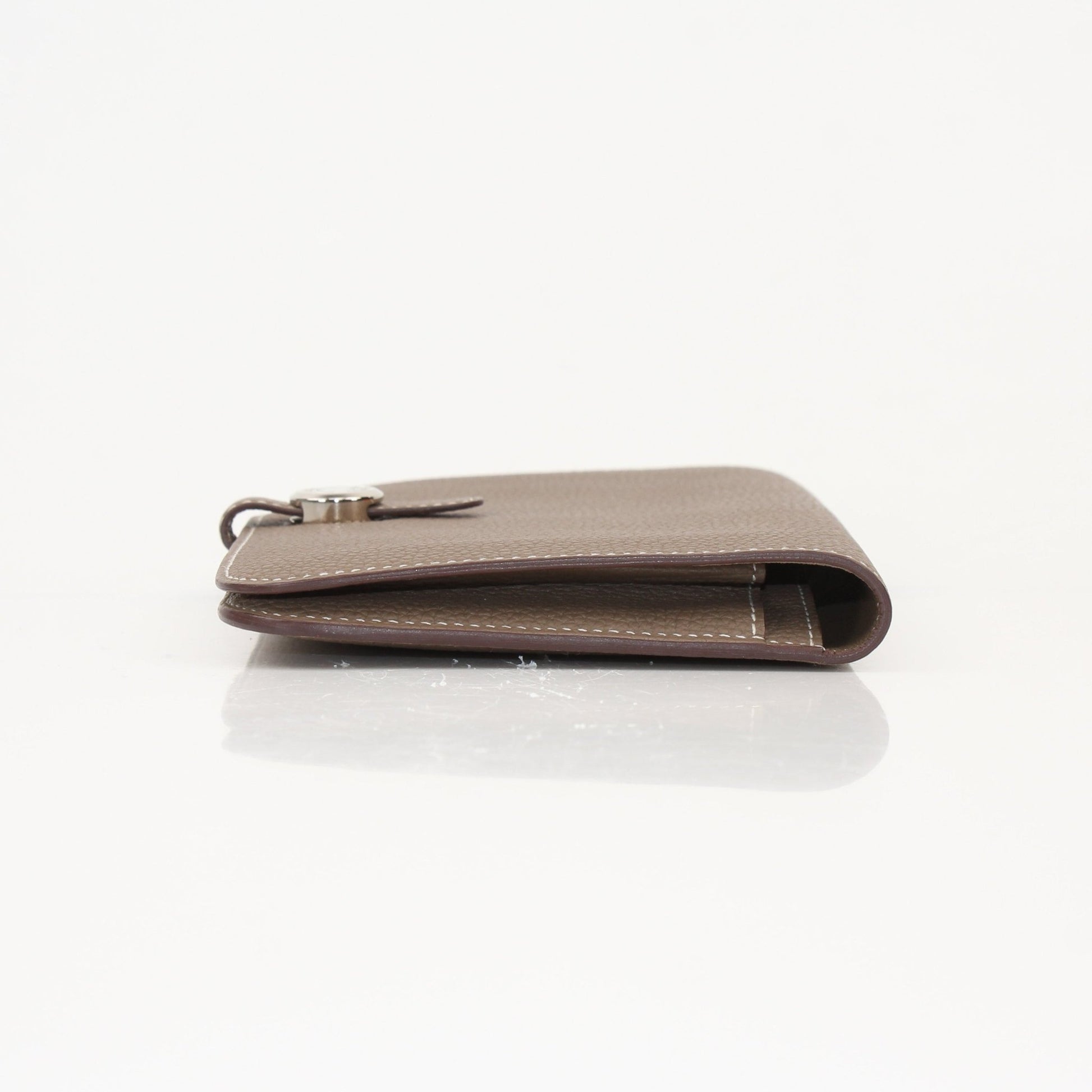 Hermès Dark Gray Dogon Duo Wallet by Gold & Beyond, featuring sleek leather design and multiple card slots.