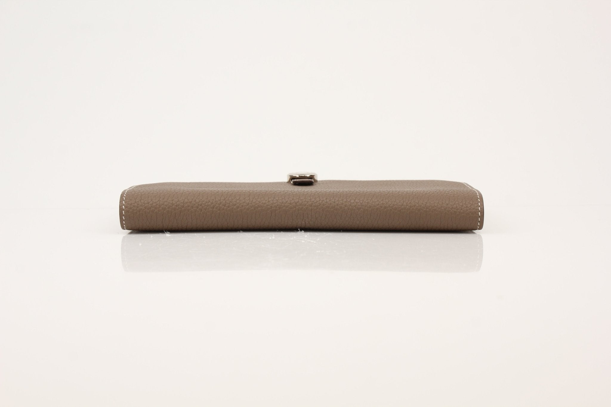 Hermès Dark Gray Dogon Duo Wallet by Gold & Beyond, showing the sleek leather wallet with multiple card slots and compact design.