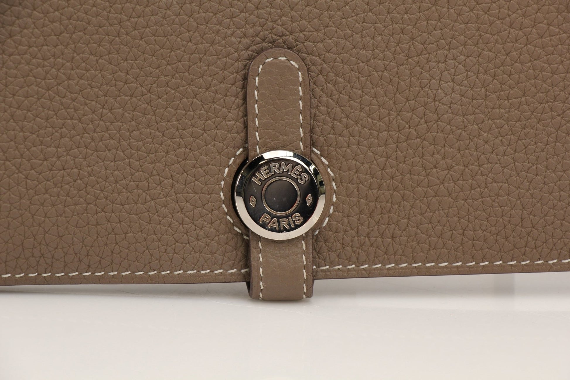 Hermès Dark Gray Dogon Duo Wallet by Gold & Beyond, showcasing sleek leather design with multiple card slots and compact shape.