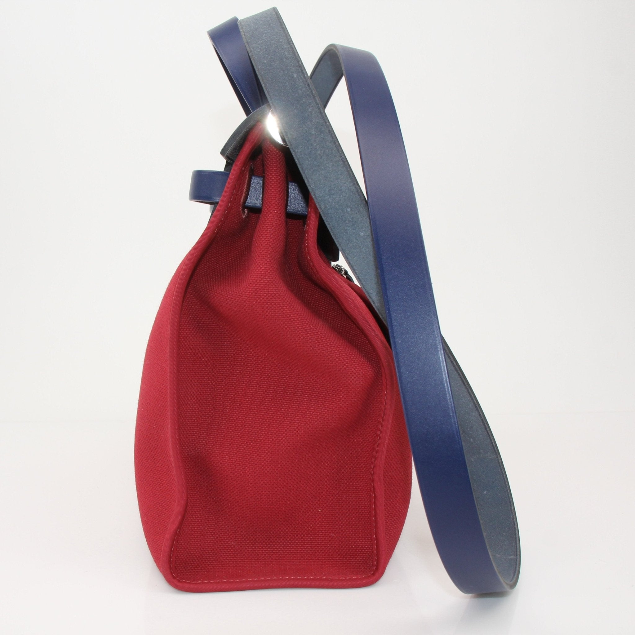Hermès Herbag handbag by Gold & Beyond, featuring classic design with leather and canvas accents, displayed on a neutral background.