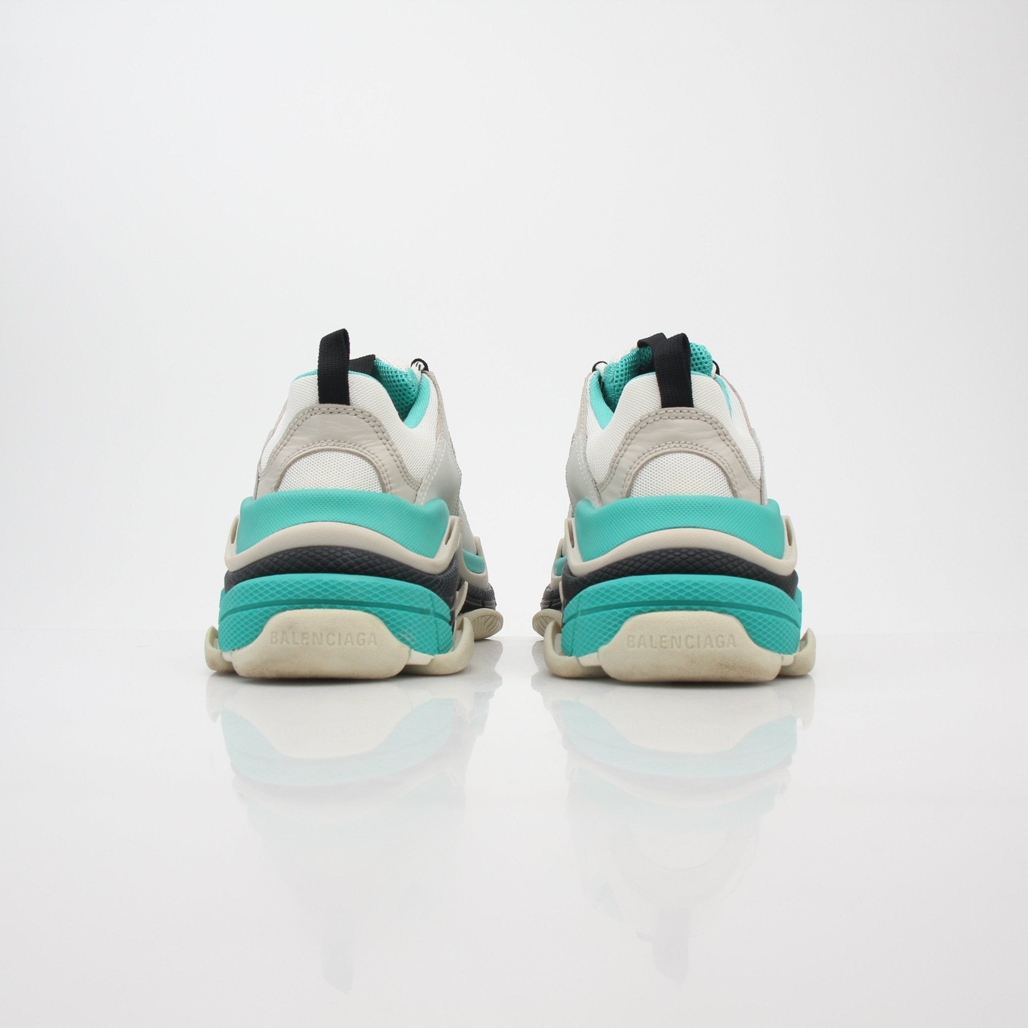 Turquoise Balenciaga Triple S Low-Top Sneakers in a detailed view, showcasing their chunky design and stylish branding.