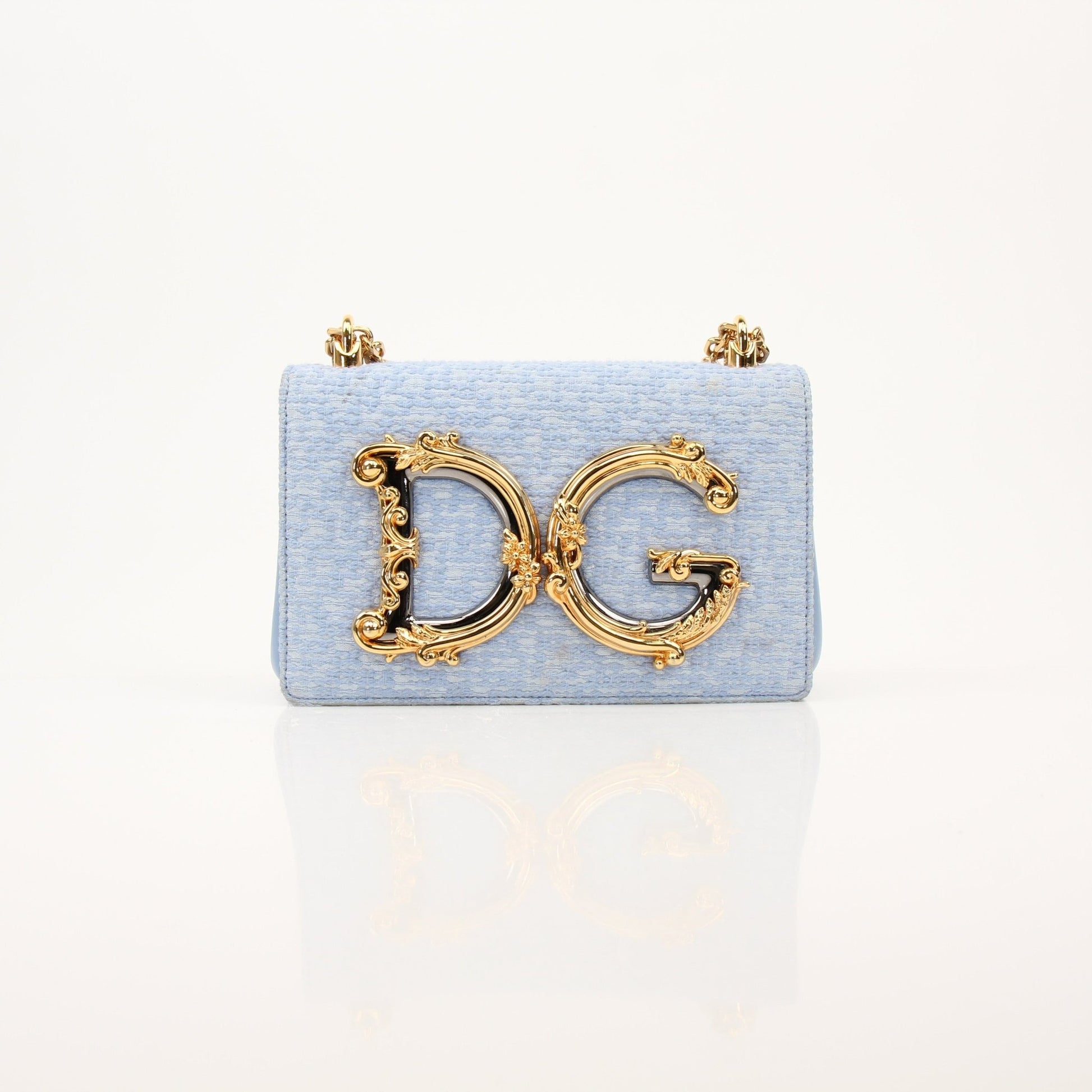 Light blue Dolce Gabbana DG Girl shoulder handbag in tweed fabric, stylish and elegant for everyday or special occasions.