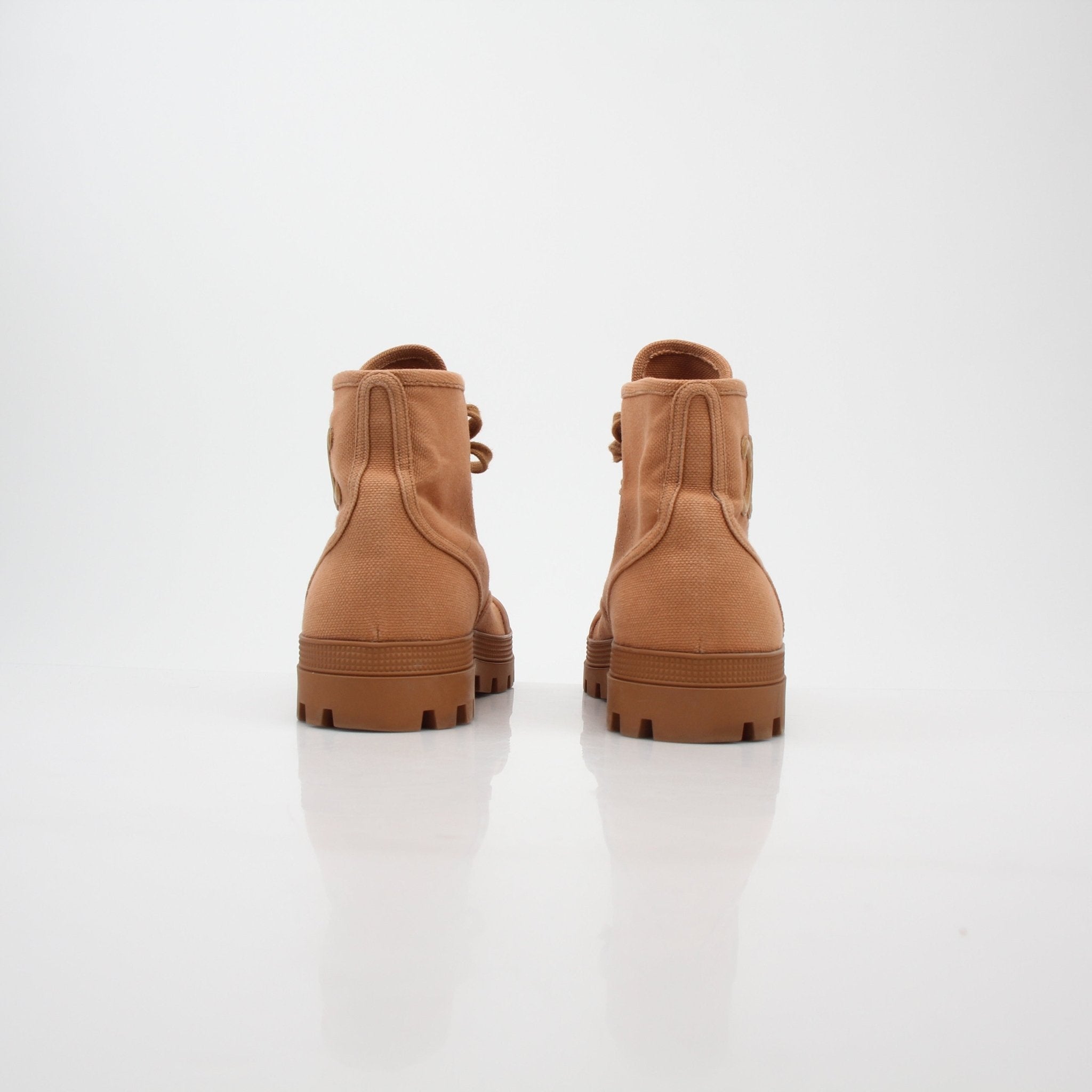 Gold & Beyond Celine Tan Patapans lace-up boots with leather uppers and sturdy soles, displayed on a neutral background.