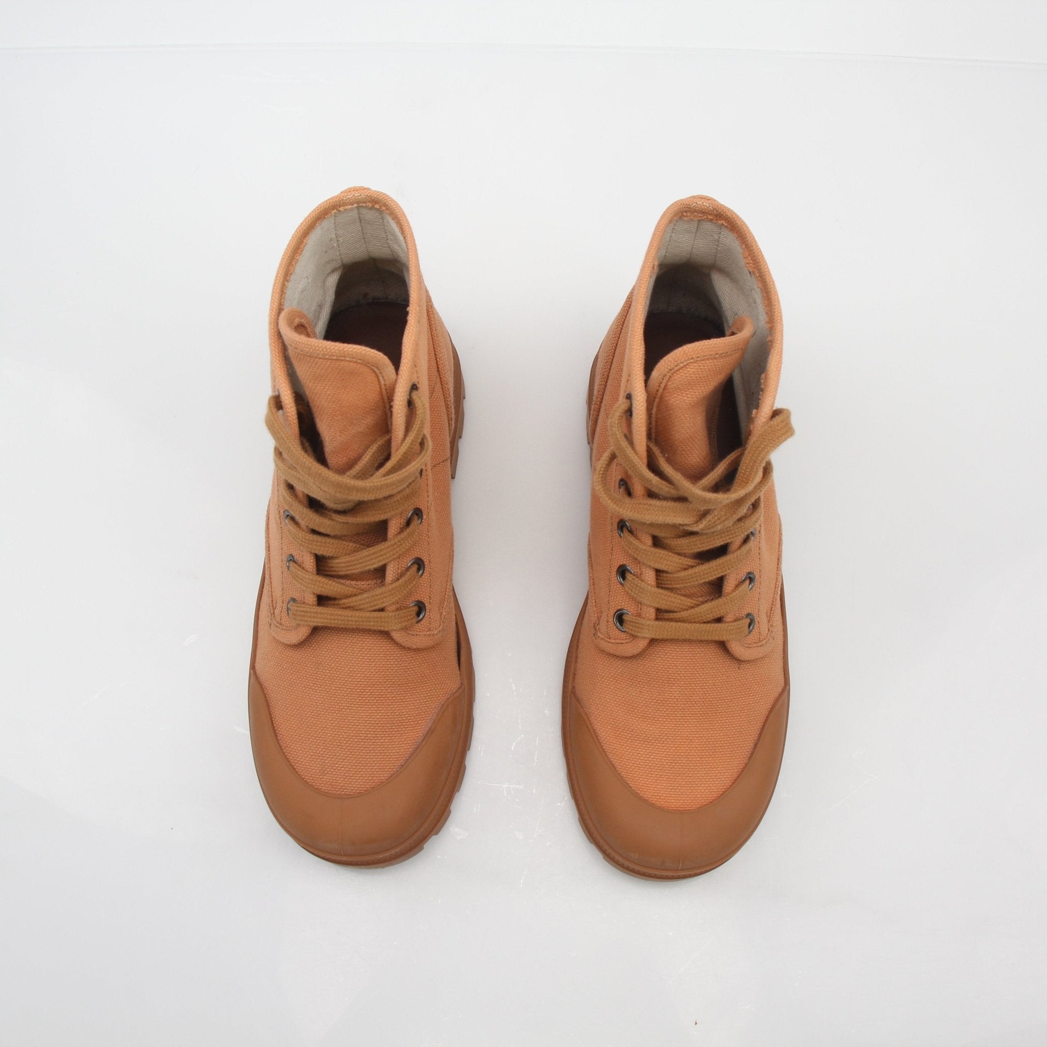 Gold & Beyond Celine Tan Patapans lace-up boots with stylish design and sturdy sole, perfect for casual and trendy footwear.