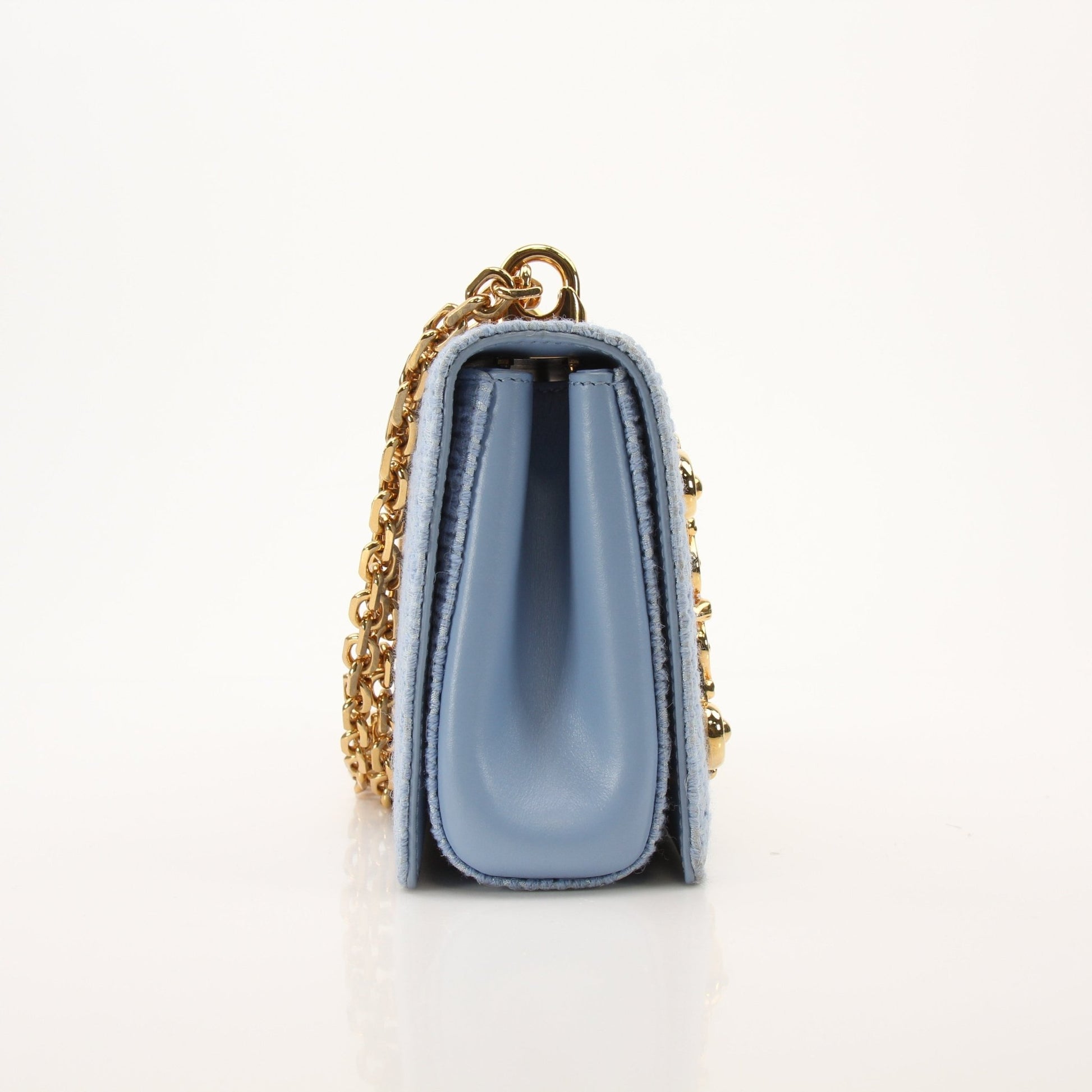 Light blue Dolce Gabbana DG Girl shoulder handbag with tweed fabric, featuring a stylish and elegant design.