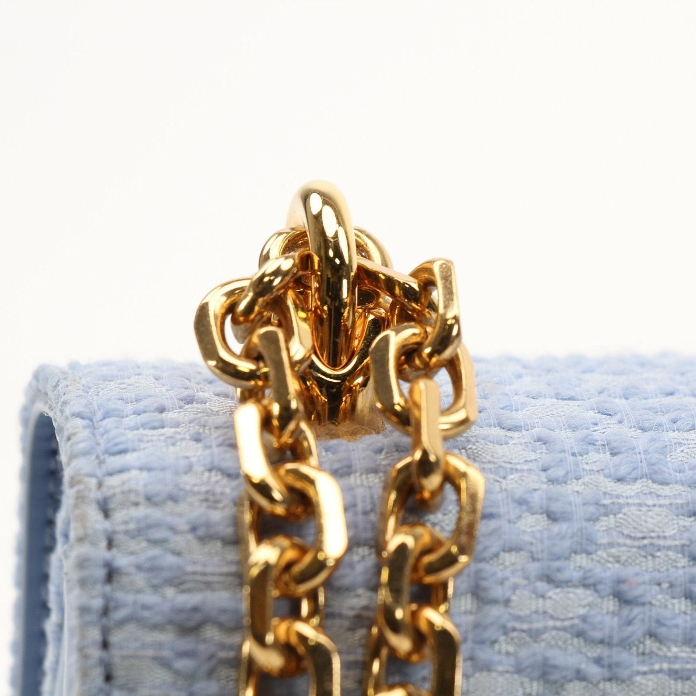 Light blue tweed Dolce Gabbana DG Girl shoulder handbag with gold accents, stylish and elegant for everyday or special occasions.