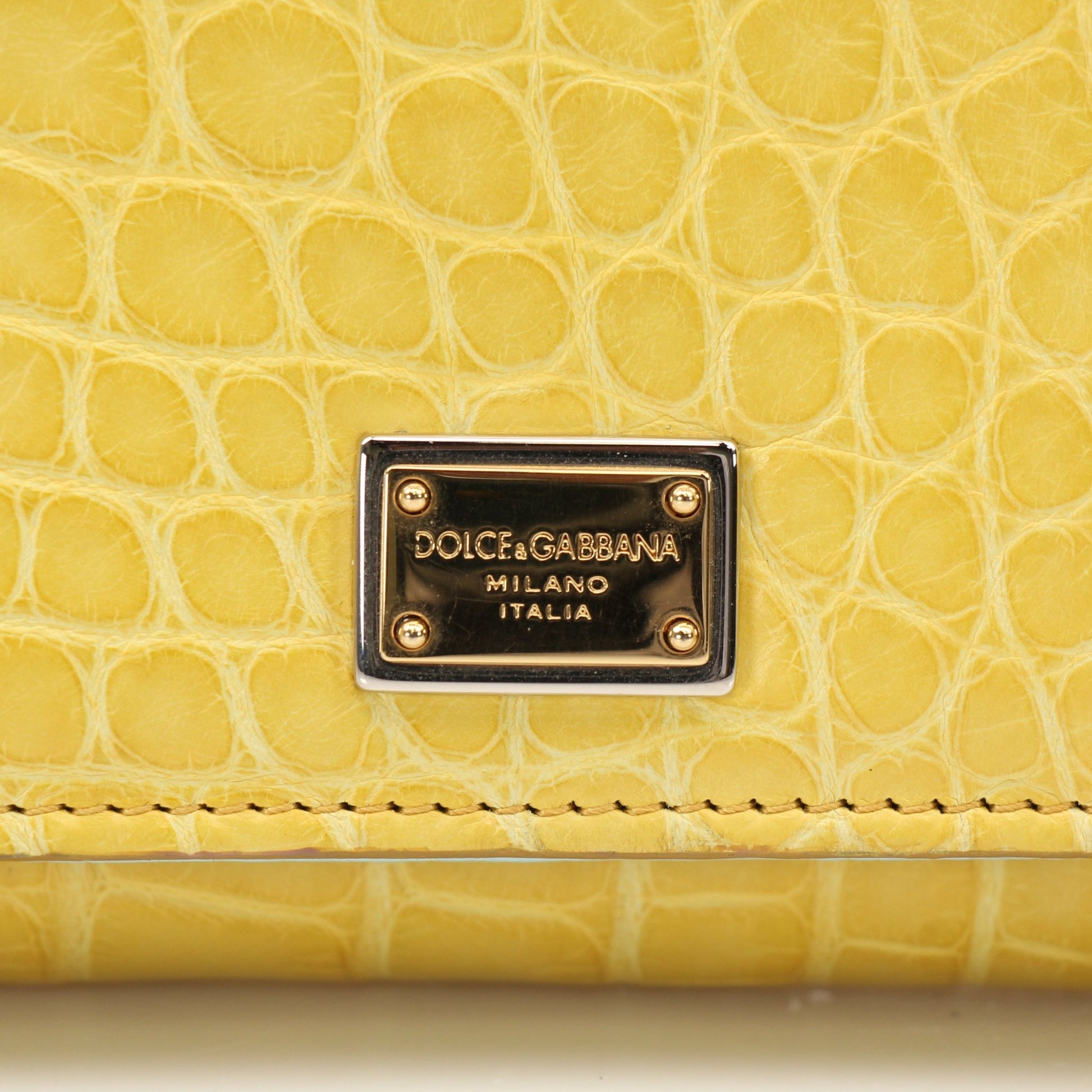 Yellow leather Dolce & Gabbana Von Mini Sicily handbag with gold hardware, stylish and compact for everyday use.