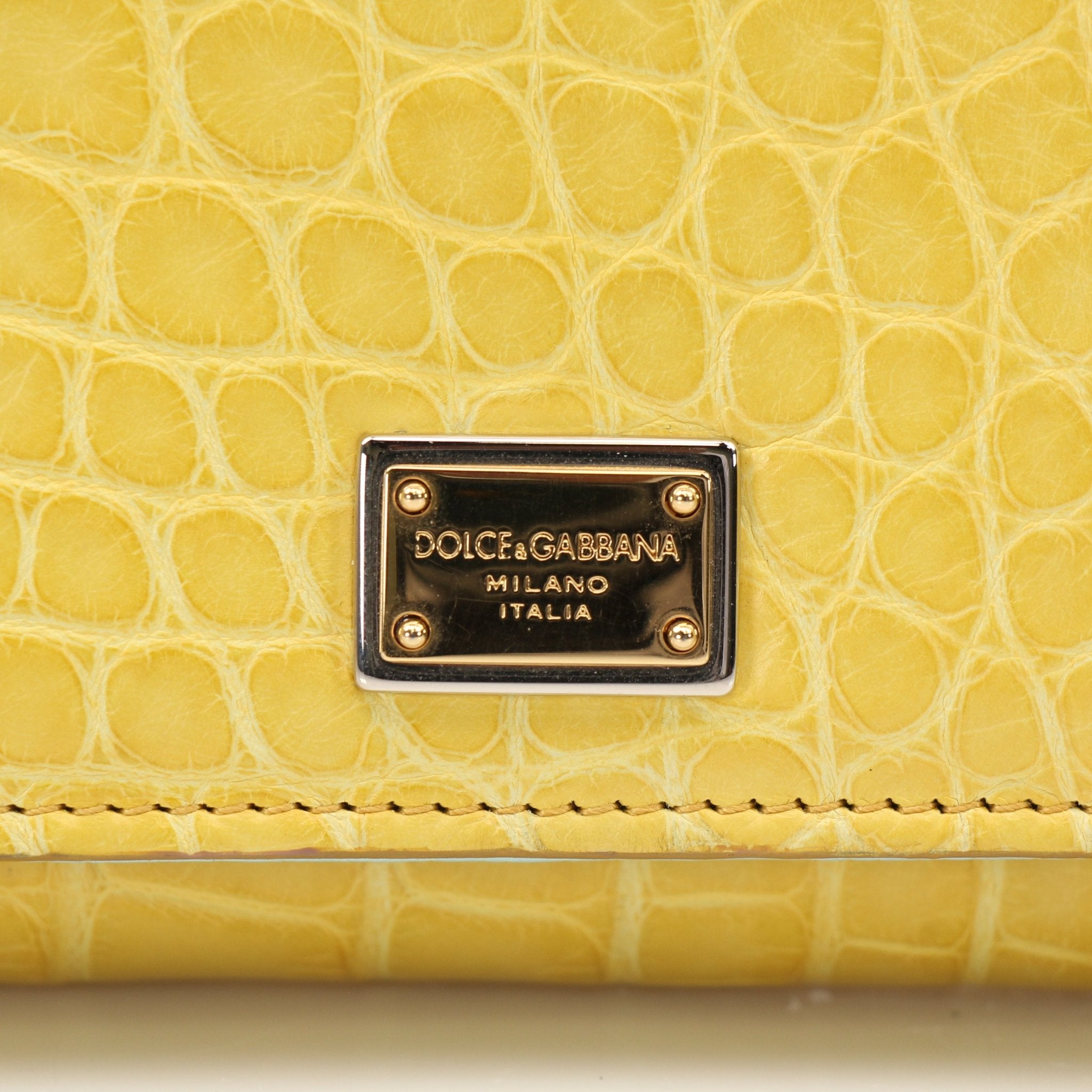 Yellow leather Dolce & Gabbana Von Mini Sicily handbag with gold hardware, stylish and compact for everyday use.