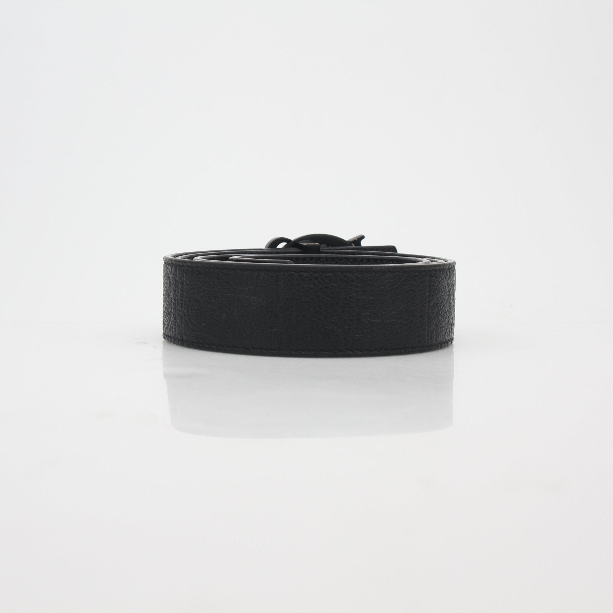 Christian Dior black leather belt with signature buckle, accessories from Gold & Beyond, showcasing the elegant designer detail.