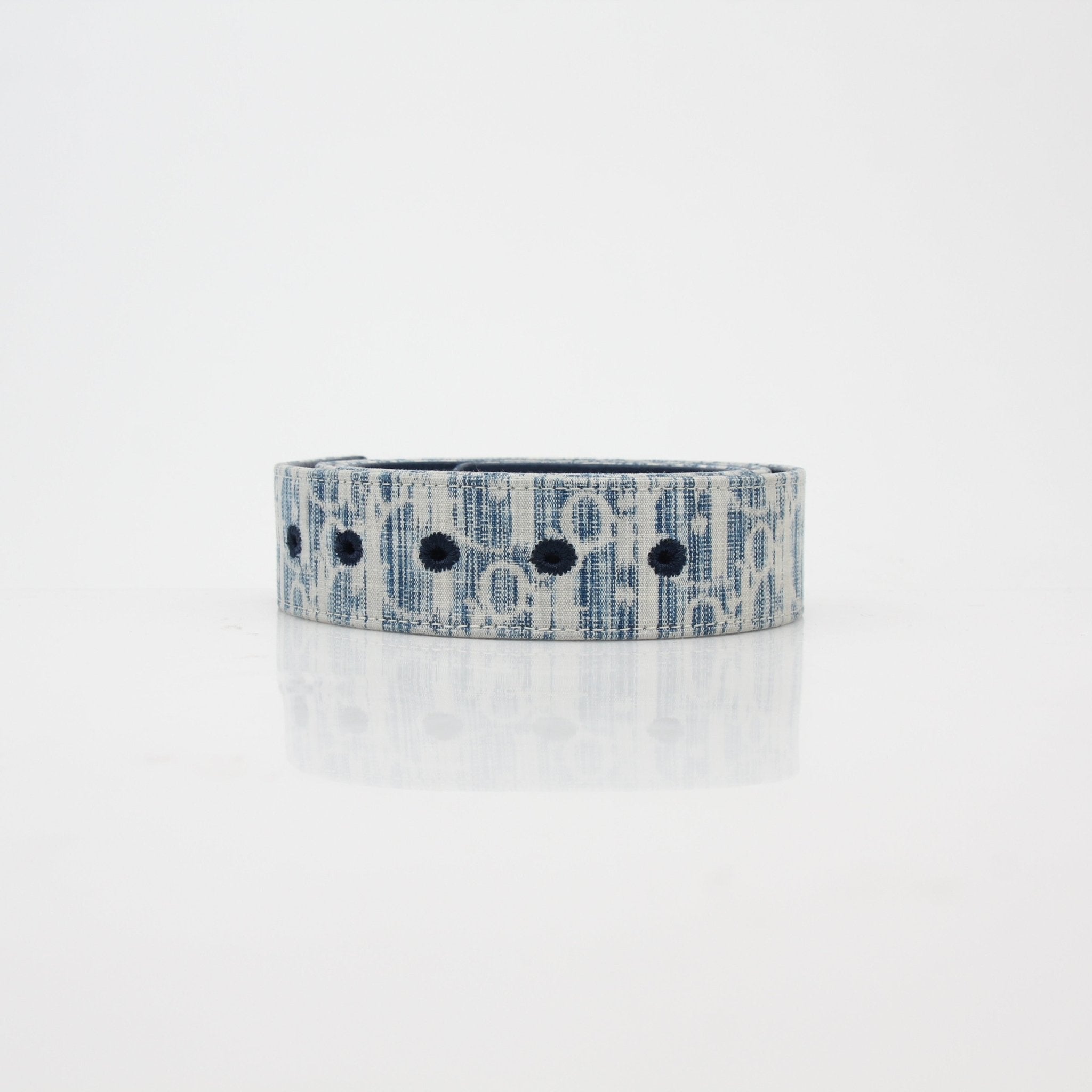 Christian Dior Blue Oblique denim reversible belt strap with gold accents, designed for accessories and high-end fashion.