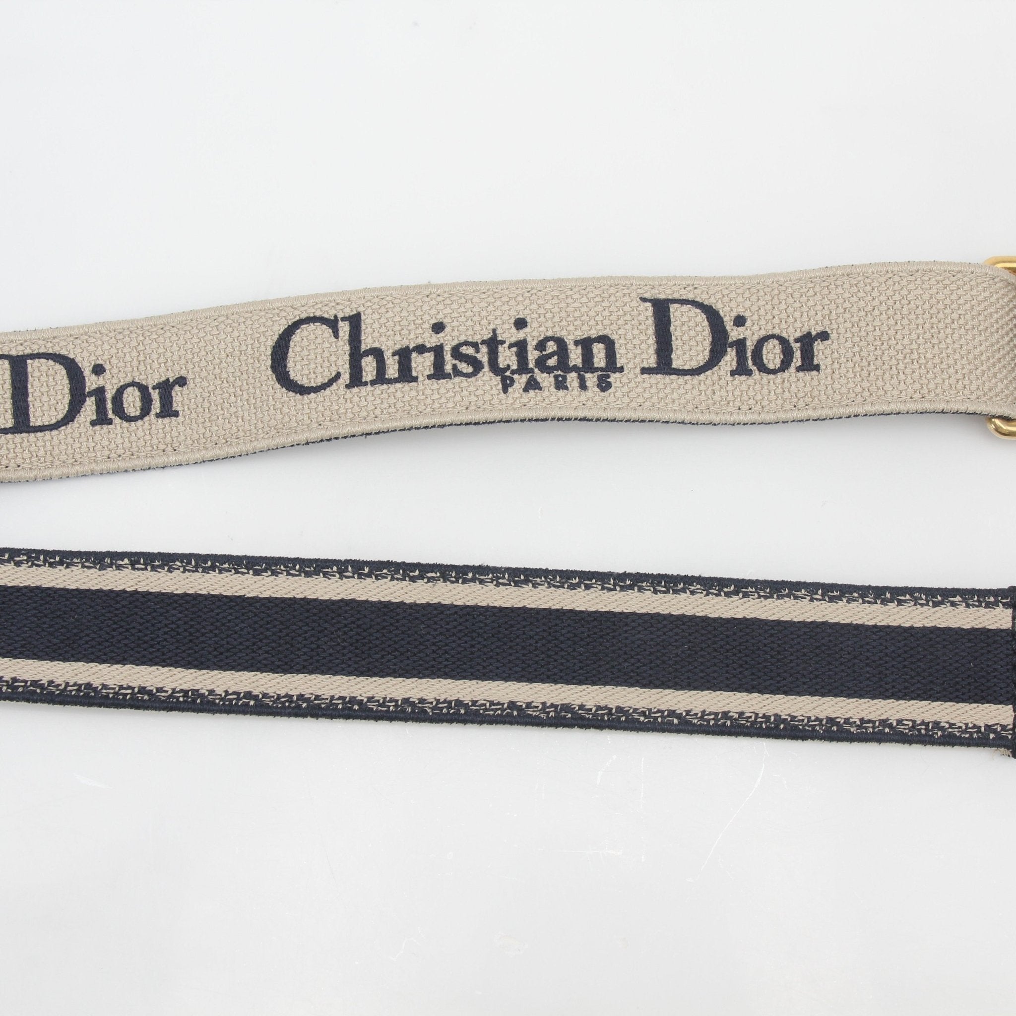 Christian Dior navy embroidered canvas shoulder strap with adjustable gold hardware, designed for accessories and bags.