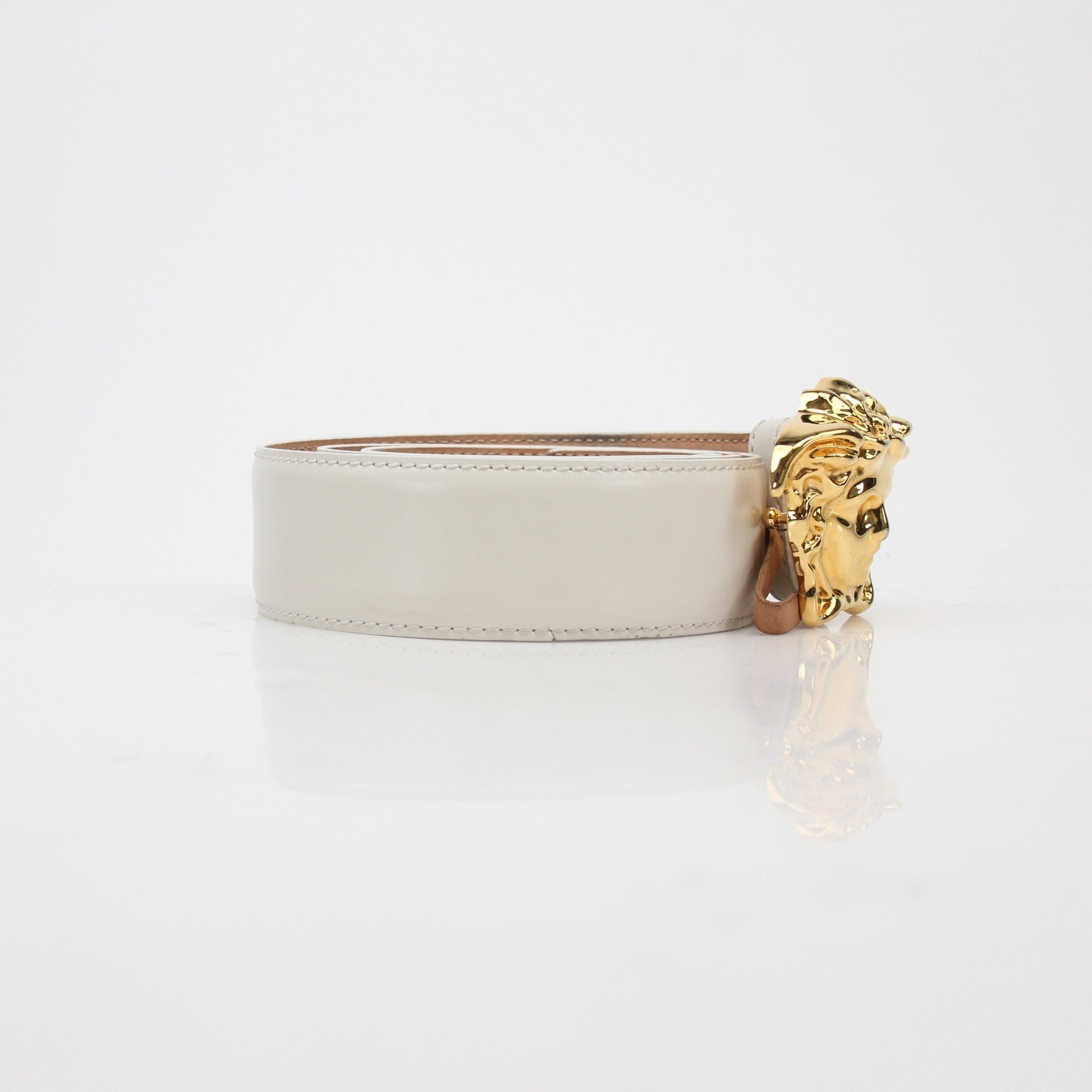 Versace White La Medusa leather belt with gold-tone buckle, stylish accessories for fashion-conscious individuals.