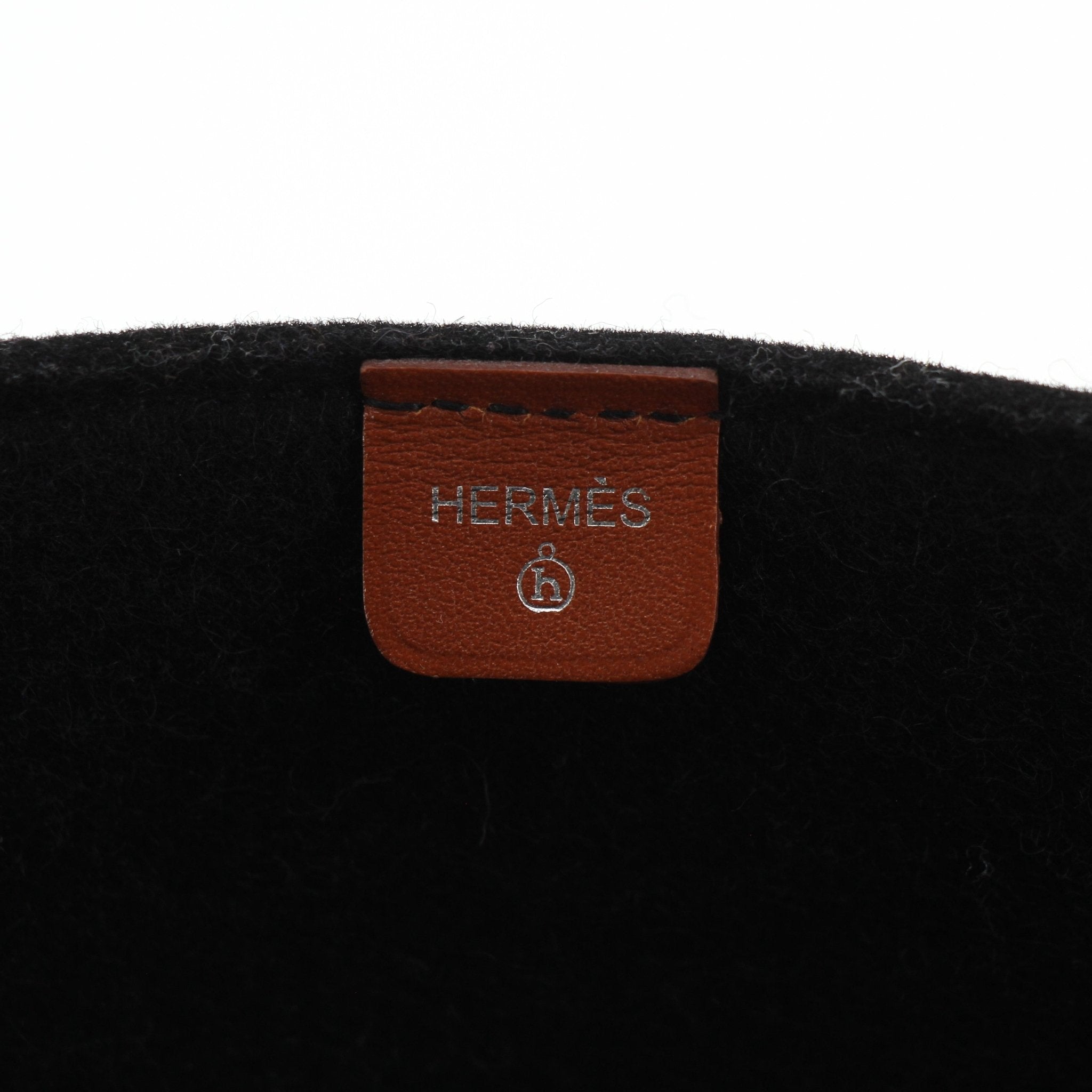 Hermès Petit H Skeleton Garden Tote handbag with leather handles and detailed design, displayed on a neutral background.